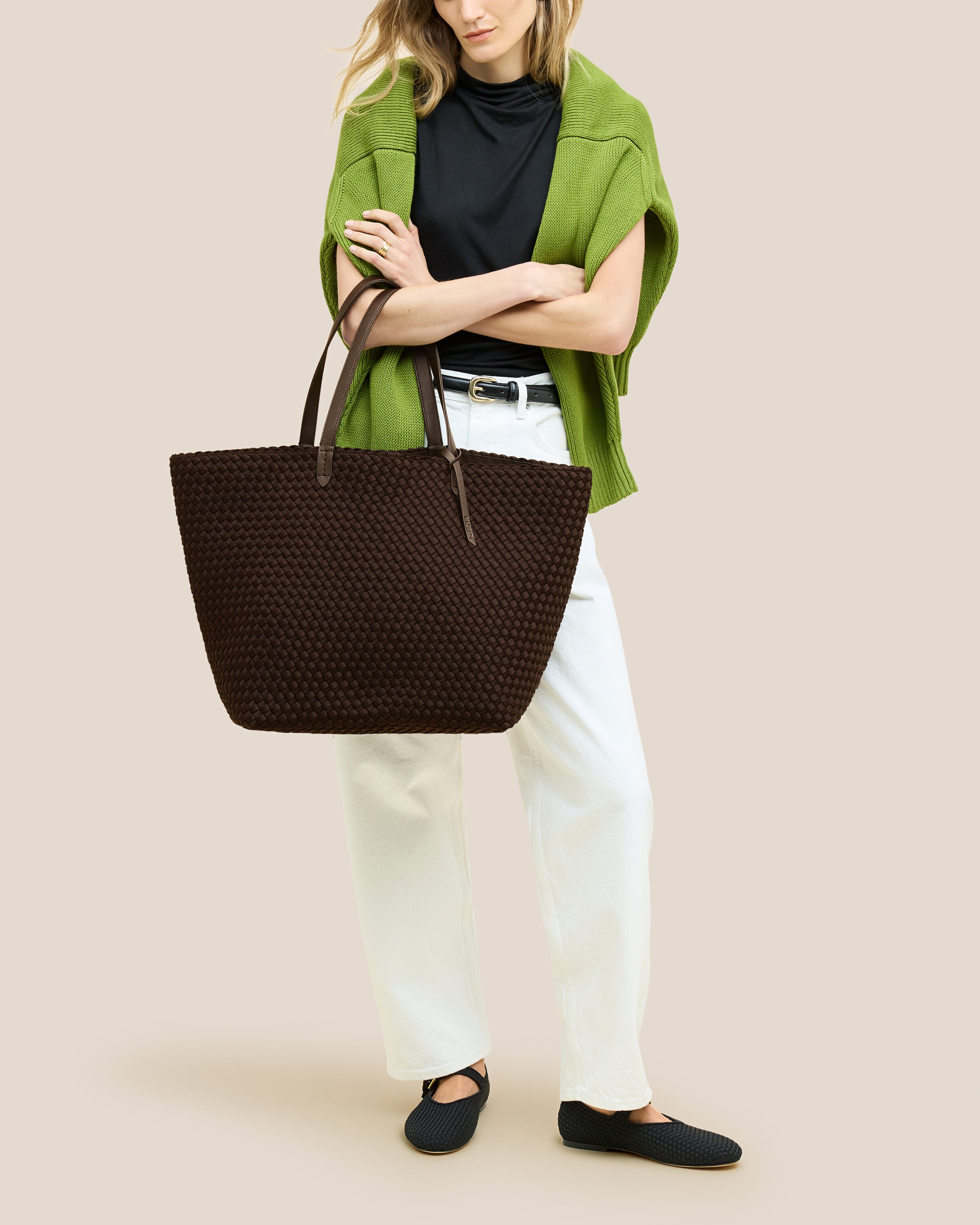 Jetsetter Tote in Chocolate shown on model to illustrate scale and soft silhouette.