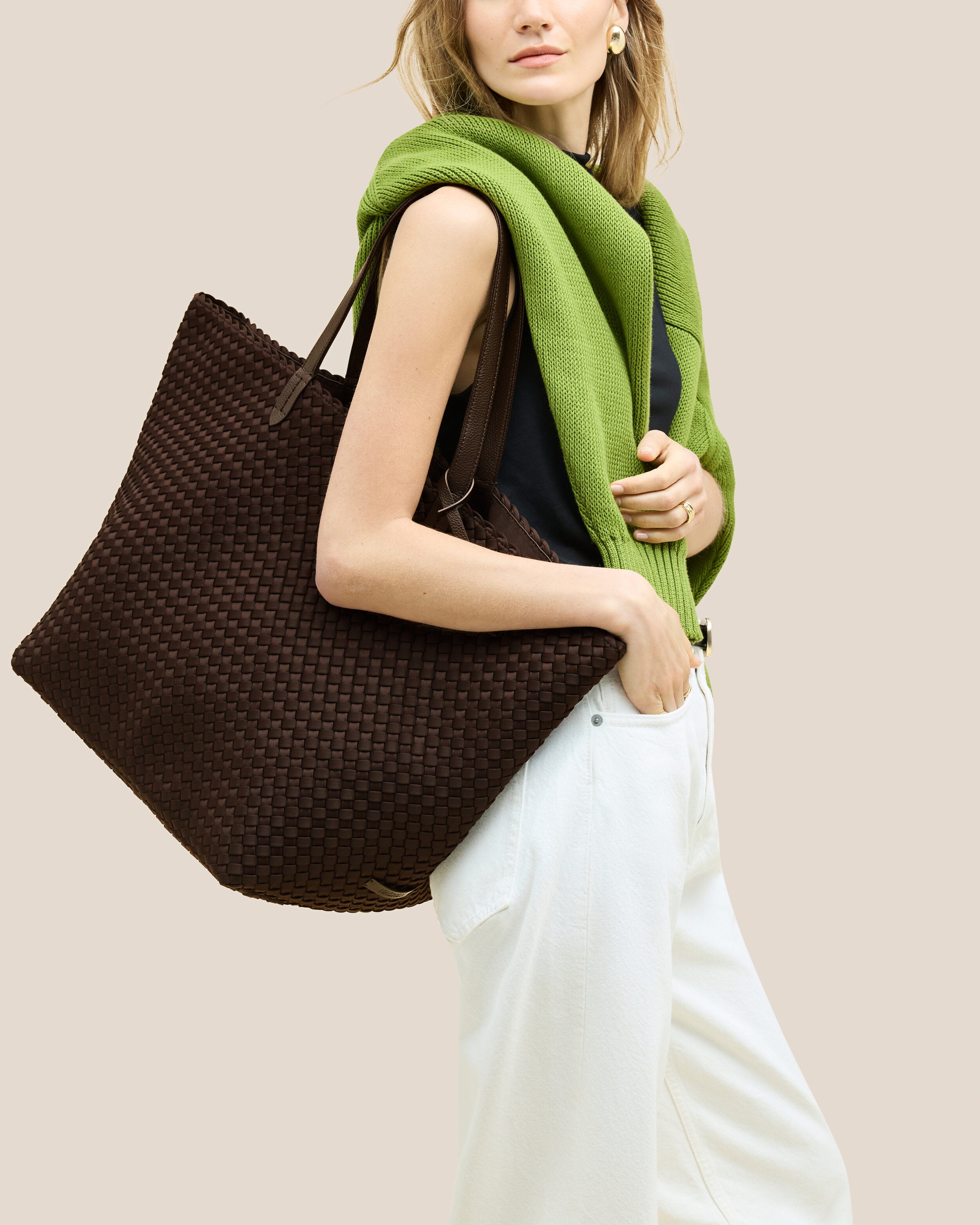 Jetsetter Tote in Chocolate shown on model to illustrate scale and soft silhouette.