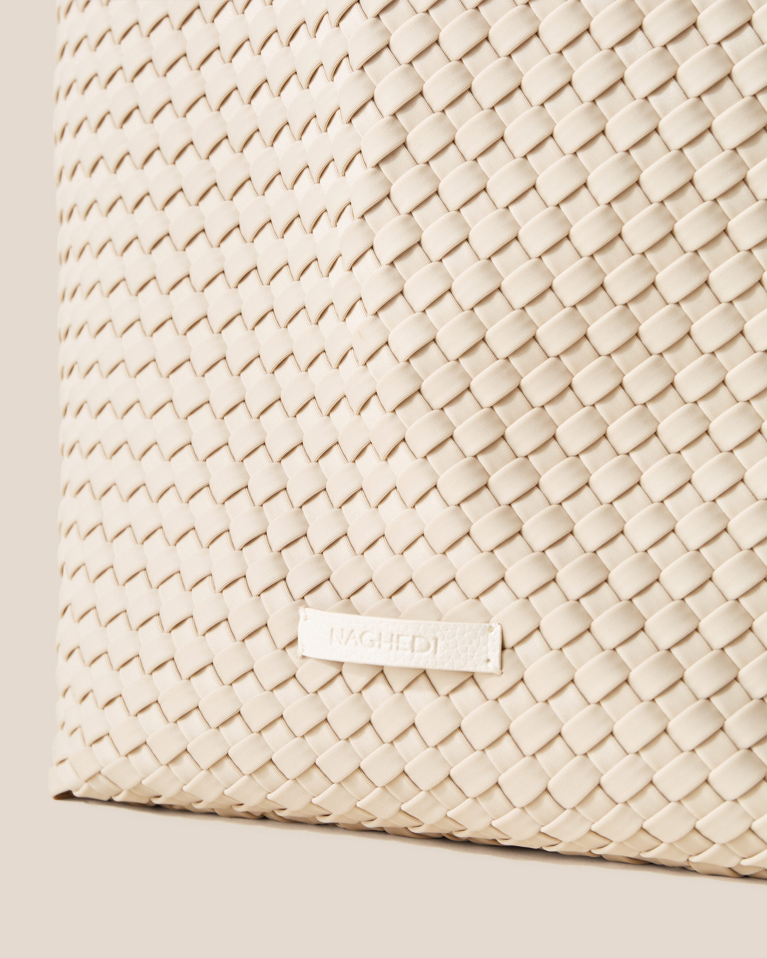 Close-up of stamped NAGHEDI logo on Jetsetter Tote in Ecru.