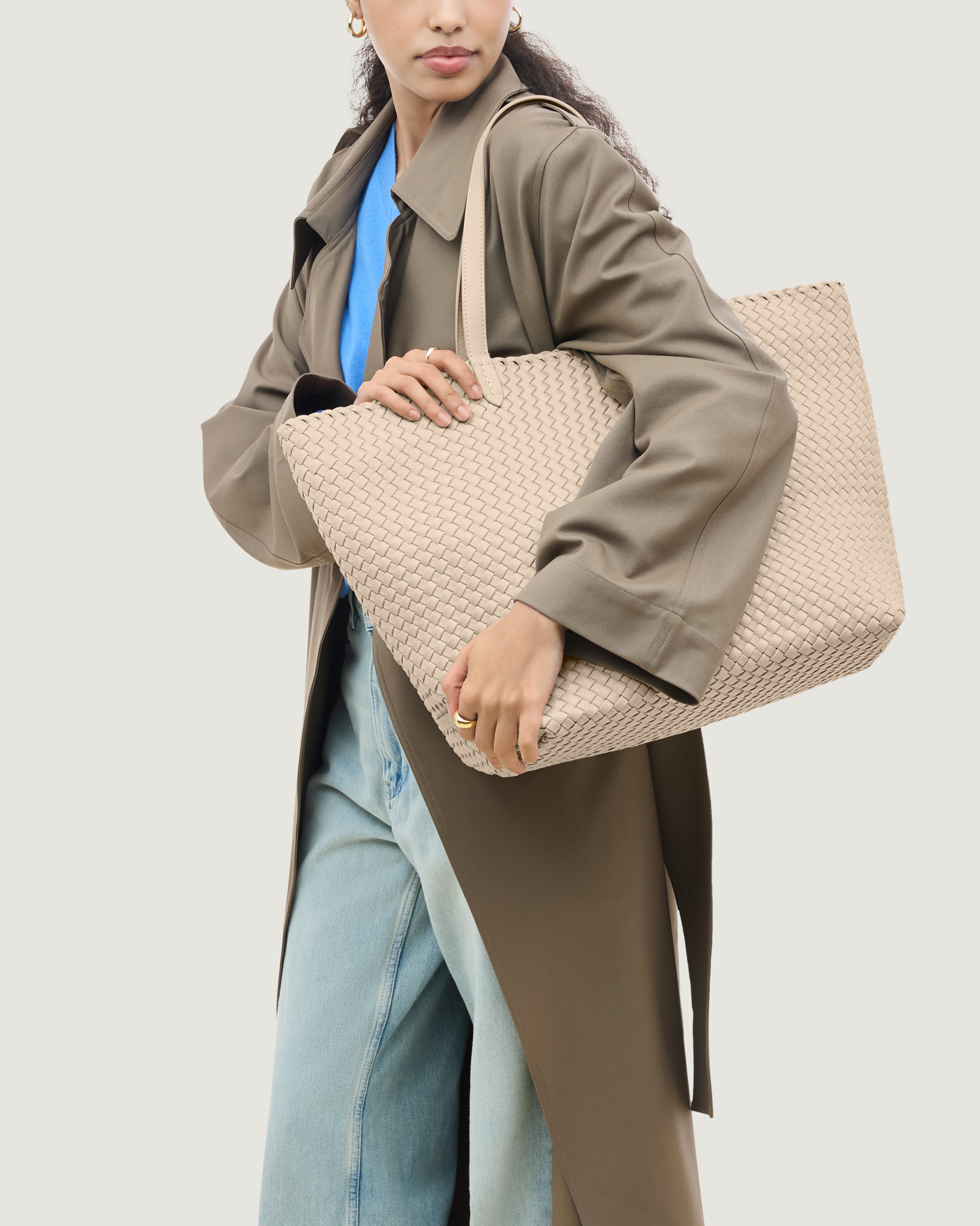 Jetsetter Tote in Ecru shown on model to illustrate scale and soft silhouette.