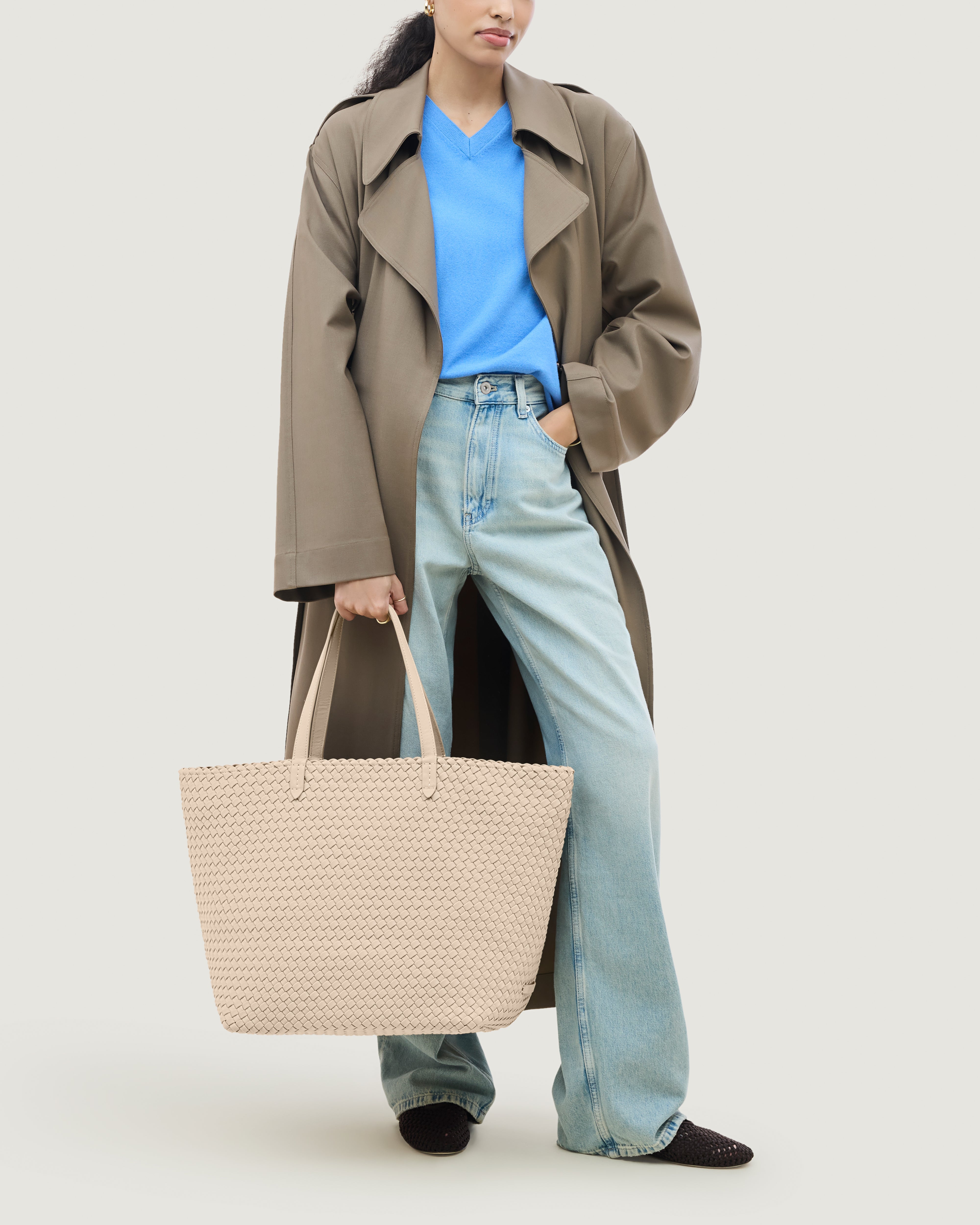 Jetsetter Tote in Ecru shown on model to illustrate scale and soft silhouette.
