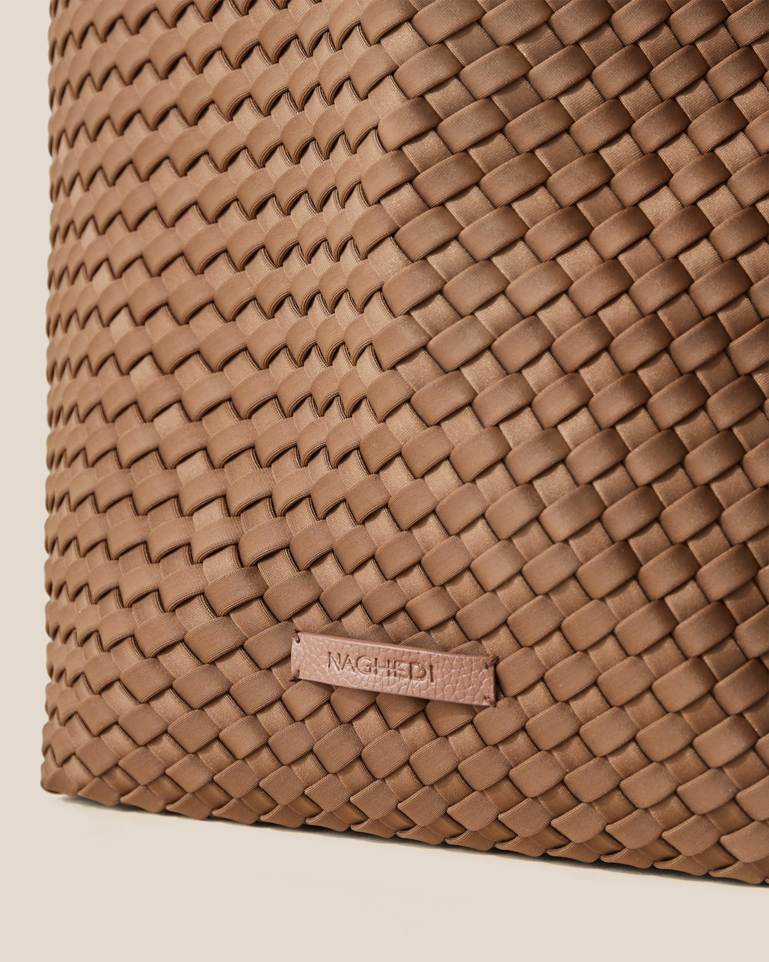 Close-up of stamped NAGHEDI logo on Jetsetter Tote in Mink.