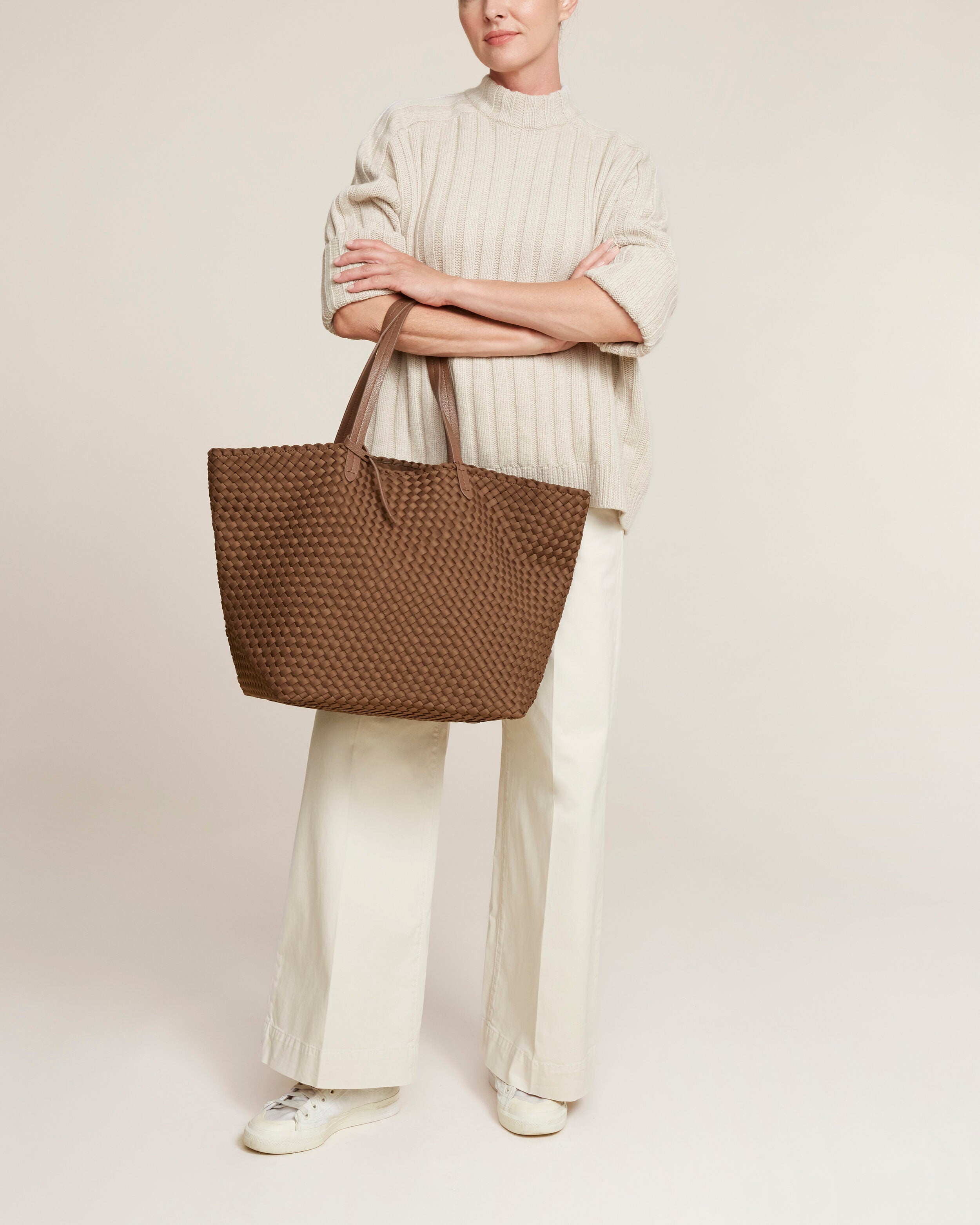 Jetsetter Tote in Mink shown on model to illustrate scale and soft silhouette.