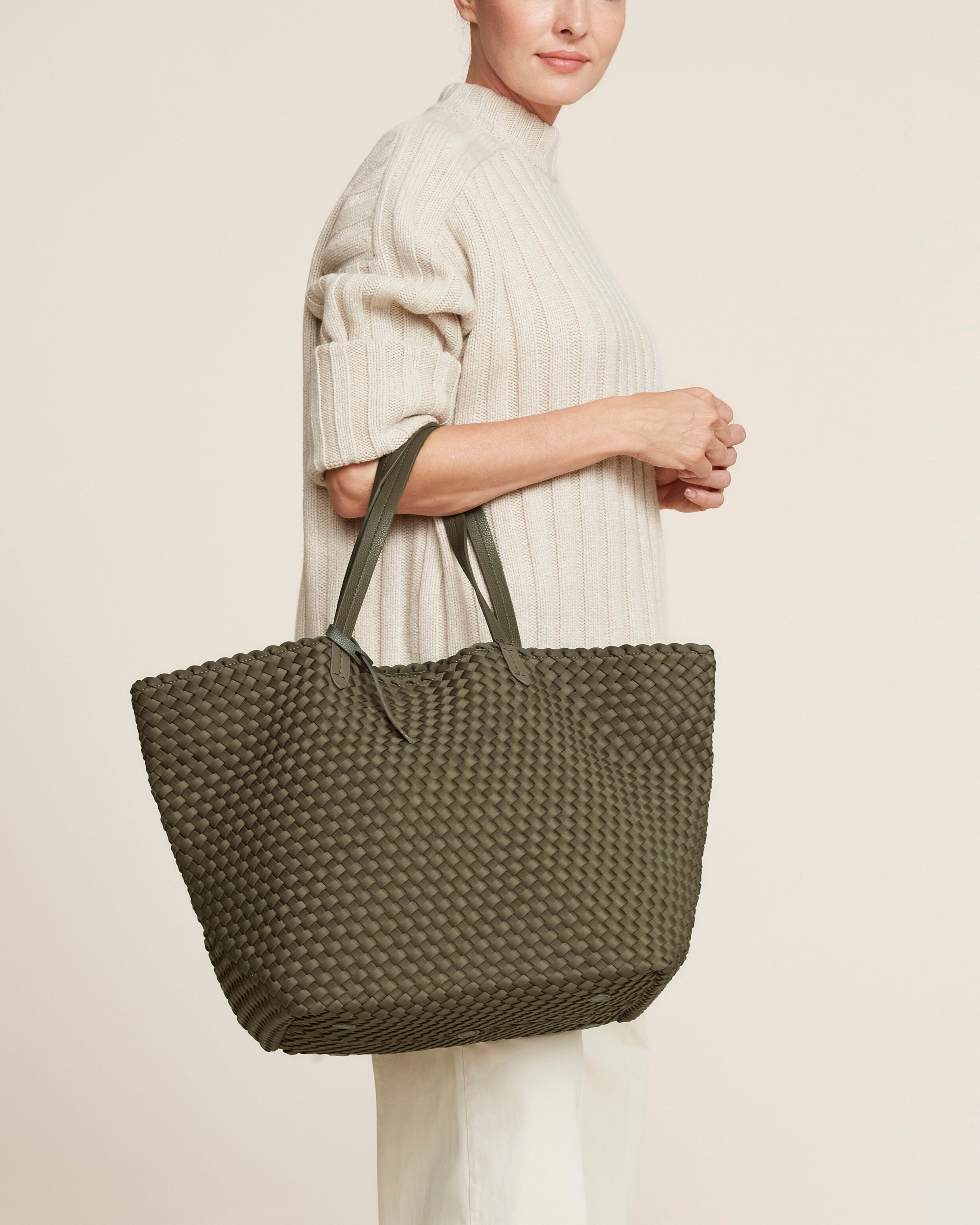 Jetsetter Tote in Olive shown on model to illustrate scale and soft silhouette.