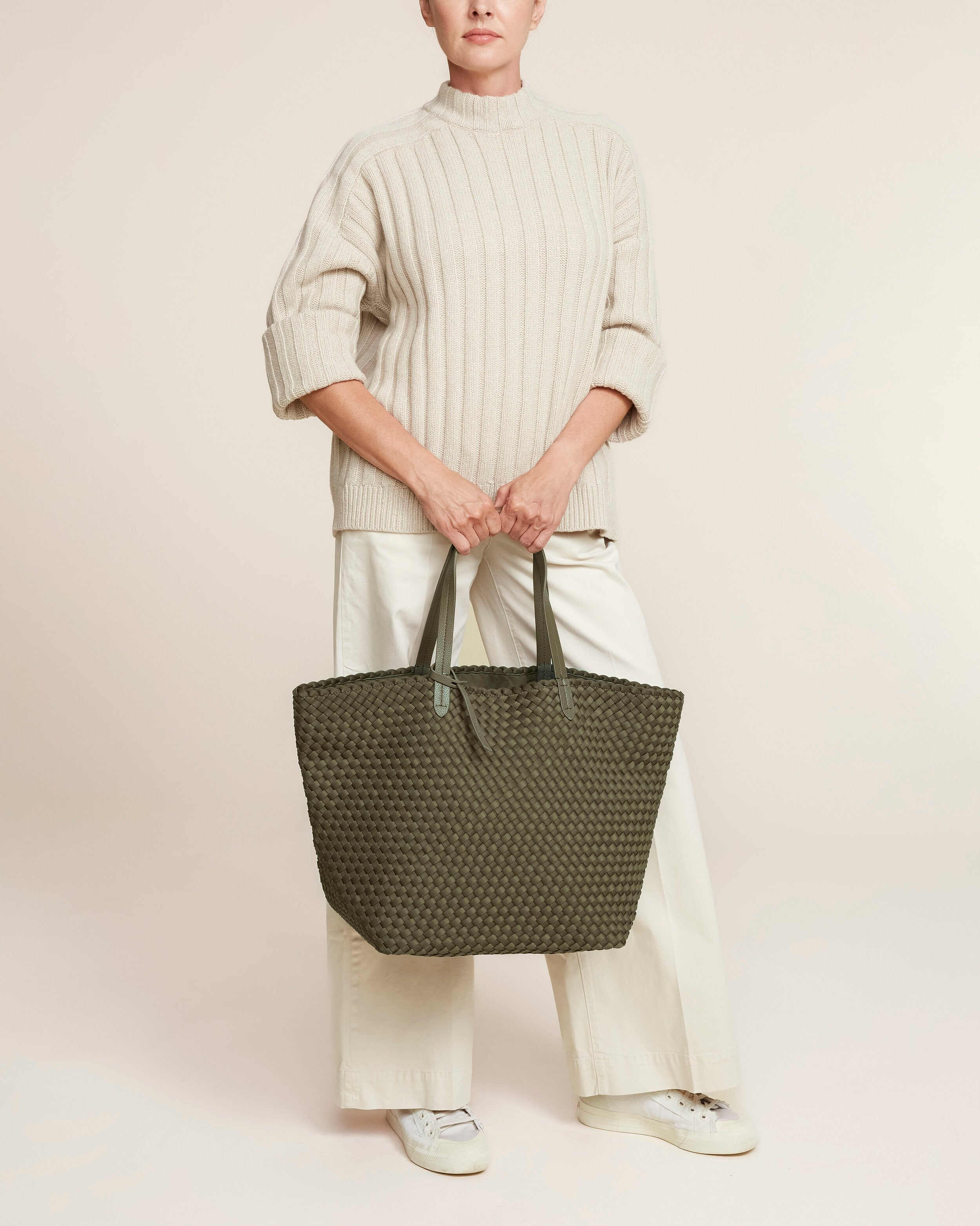 Jetsetter Tote in Olive shown on model to illustrate scale and soft silhouette.