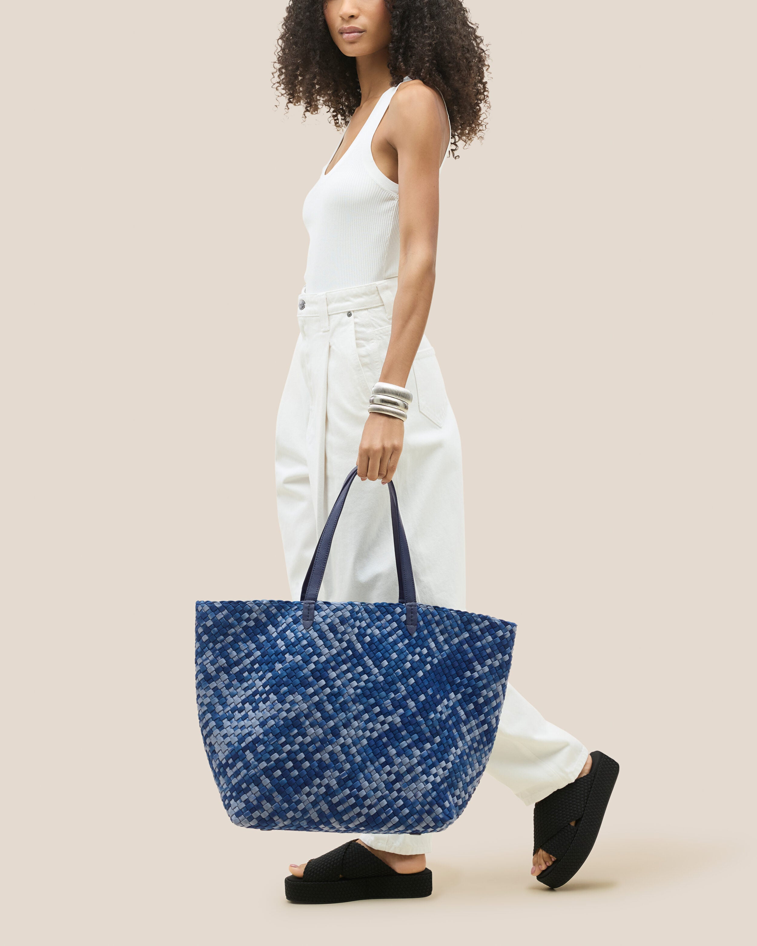 Jetsetter Tote in Paros shown on model to illustrate scale and soft silhouette.