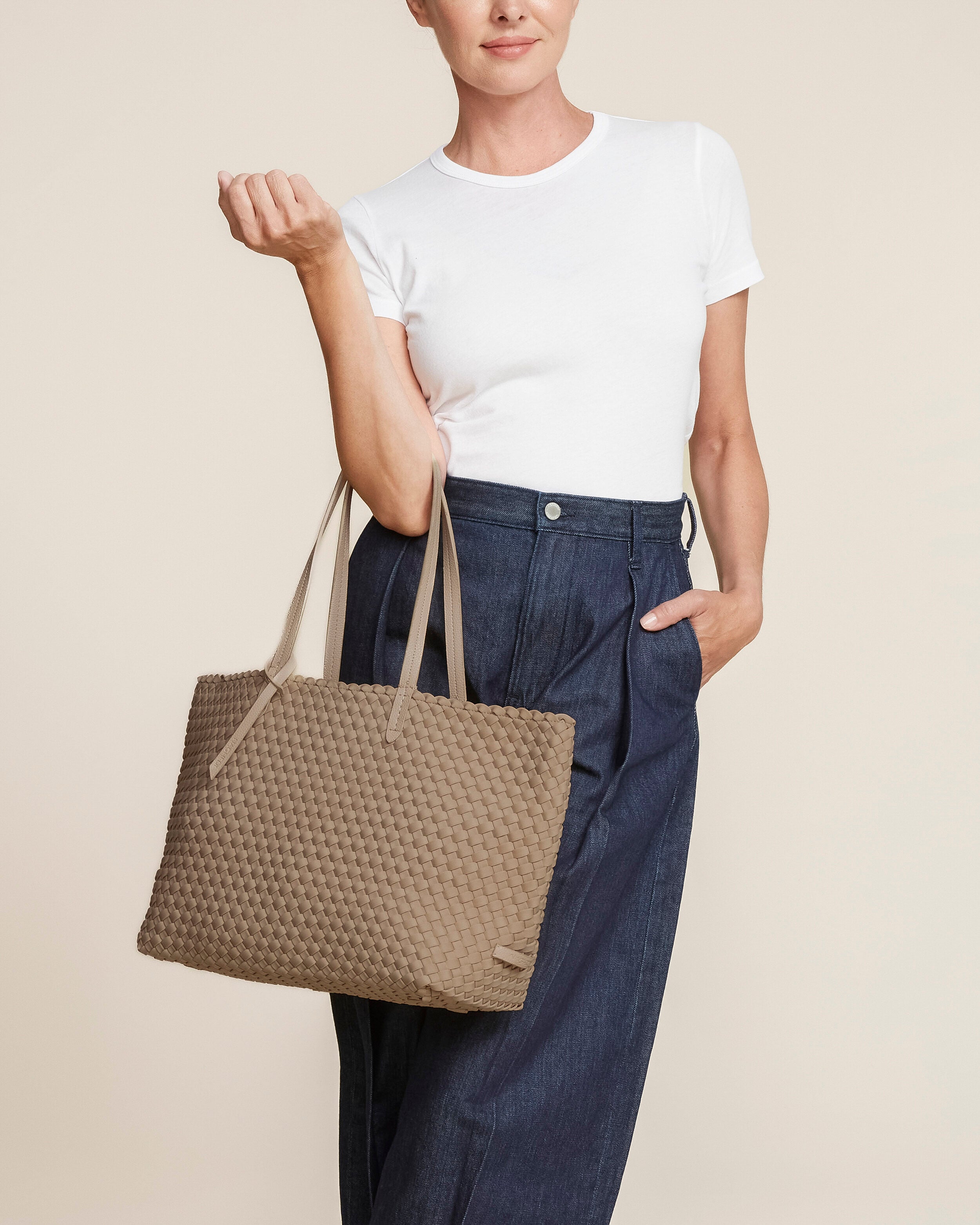 Jetsetter Tote in Cashmere shown on model to illustrate scale and soft silhouette.