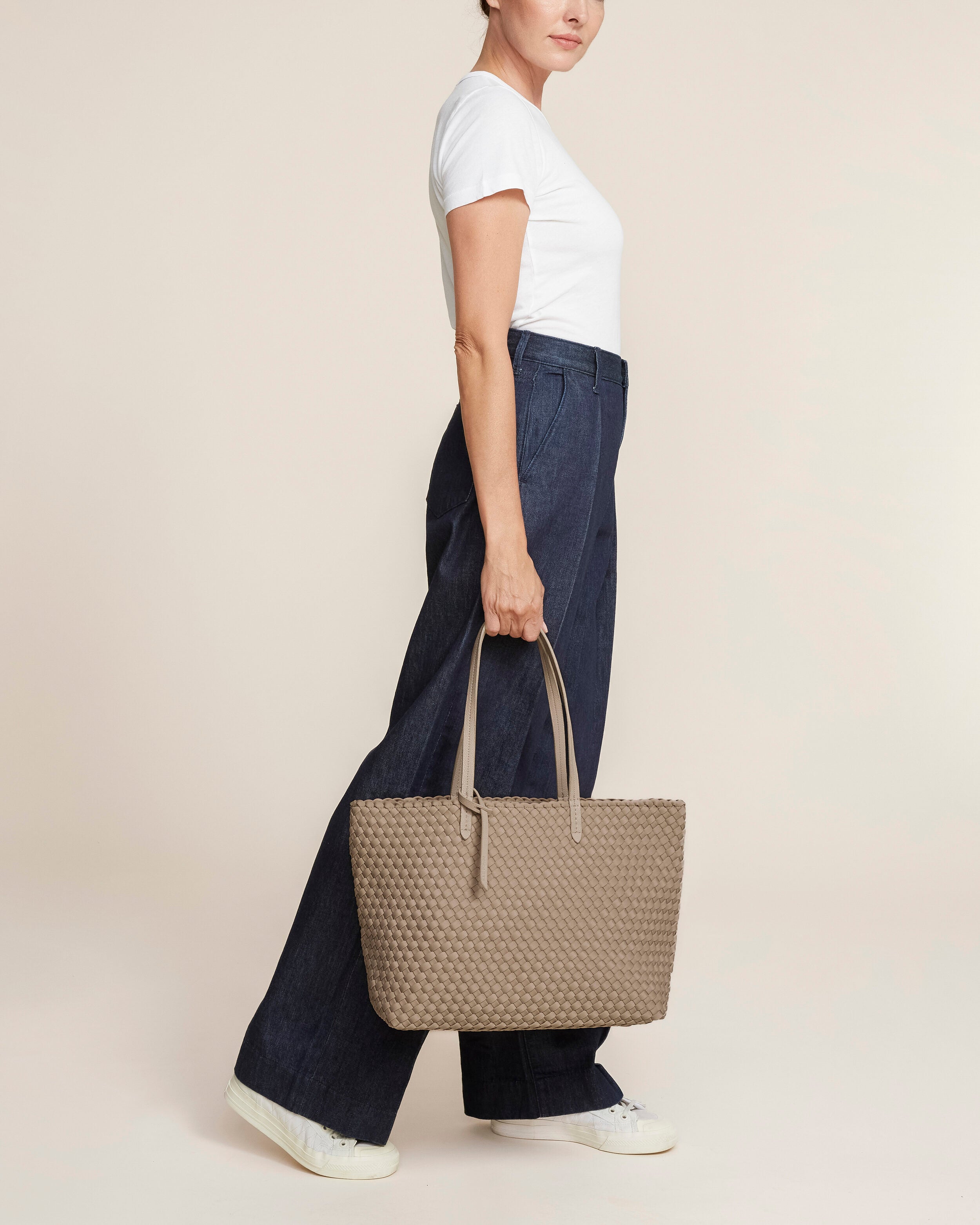 Jetsetter Tote in Cashmere shown on model to illustrate scale and soft silhouette.