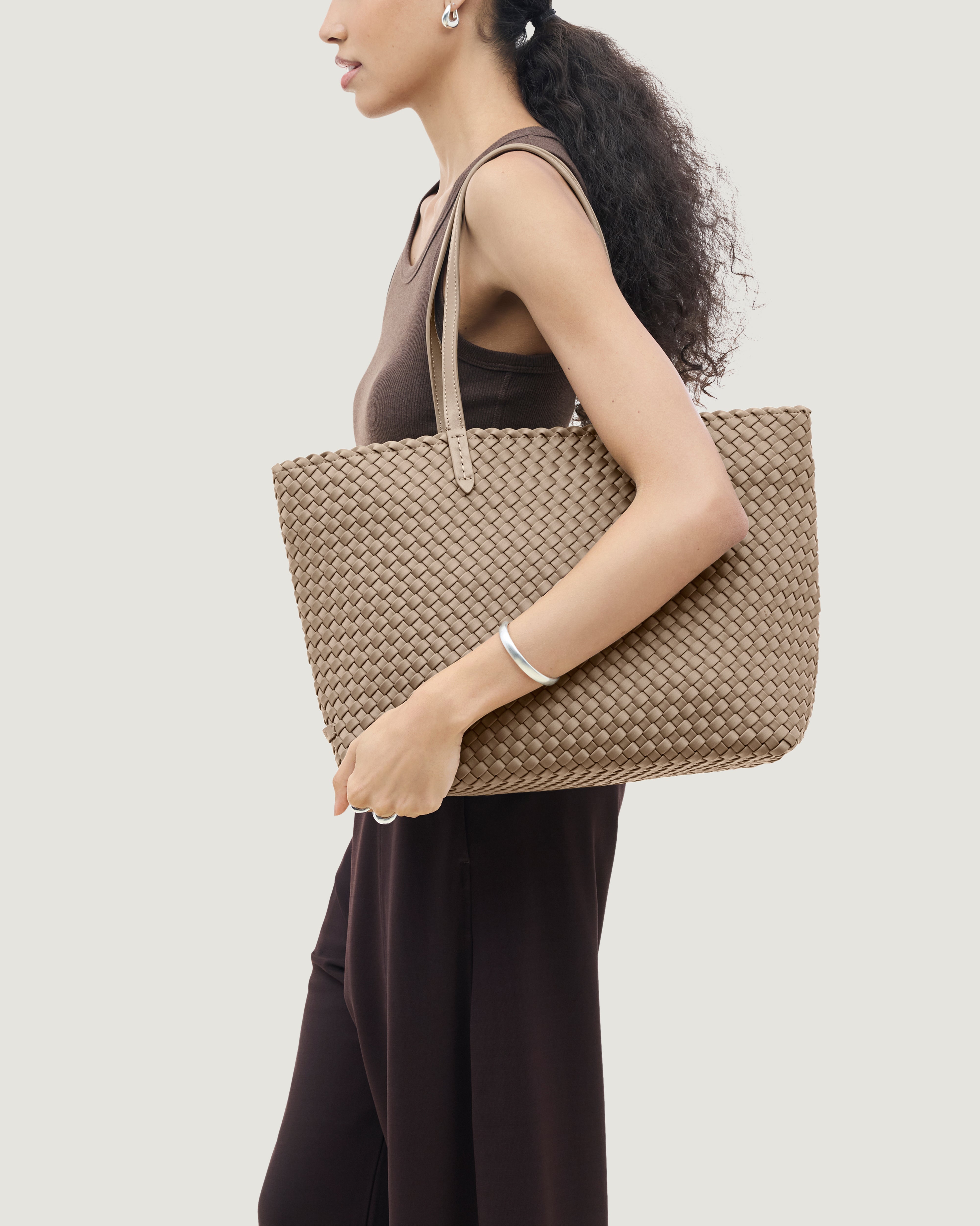 Jetsetter Tote in Cashmere shown on model to illustrate scale and soft silhouette.