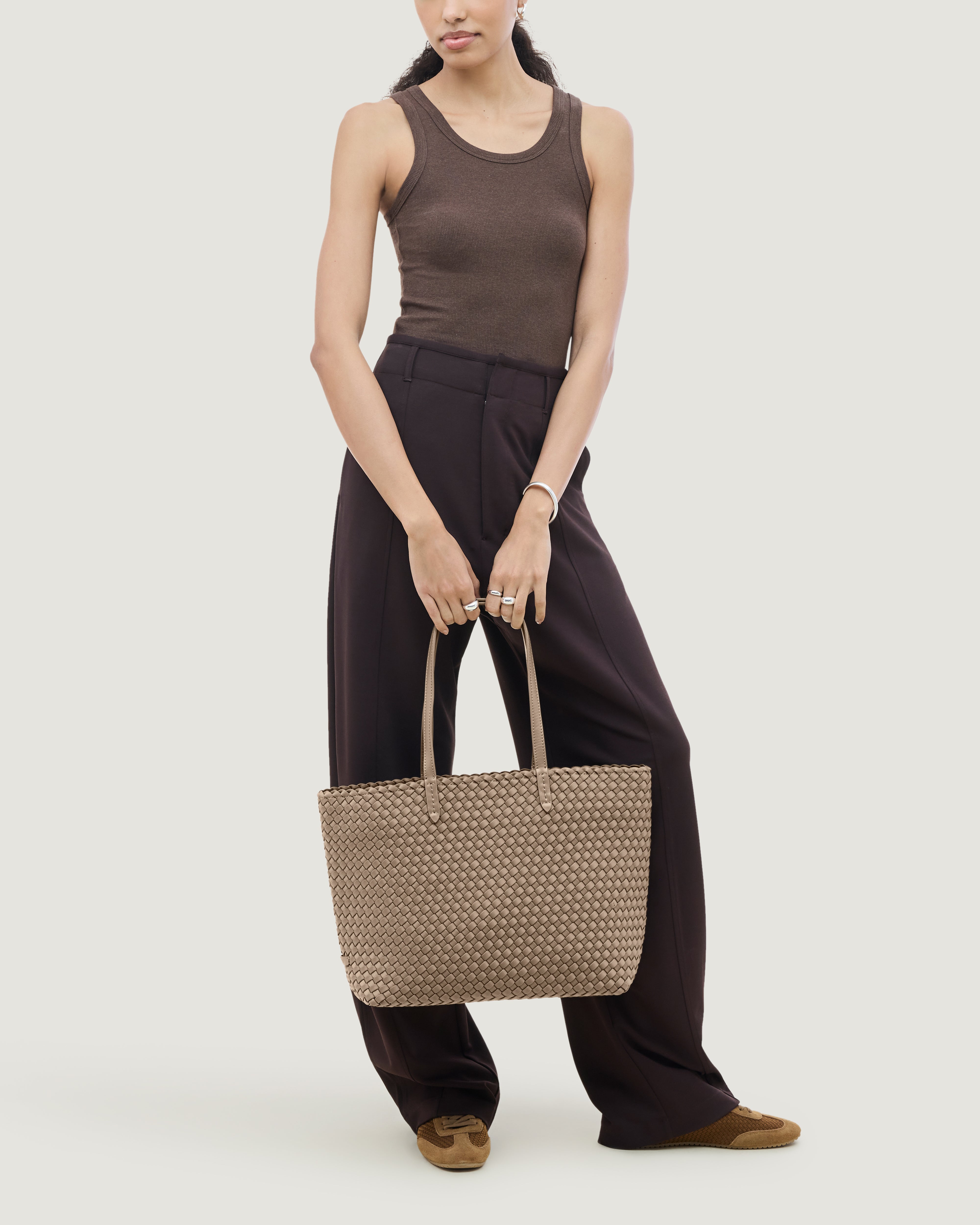Jetsetter Tote in Cashmere shown on model to illustrate scale and soft silhouette.