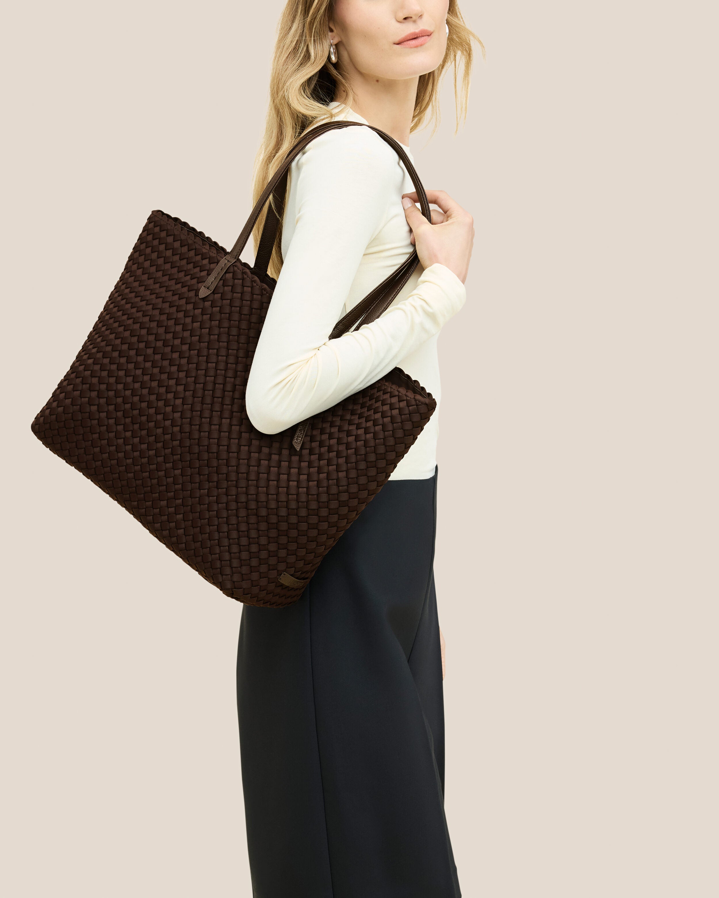 Jetsetter Tote in Chocolate shown on model to illustrate scale and soft silhouette.