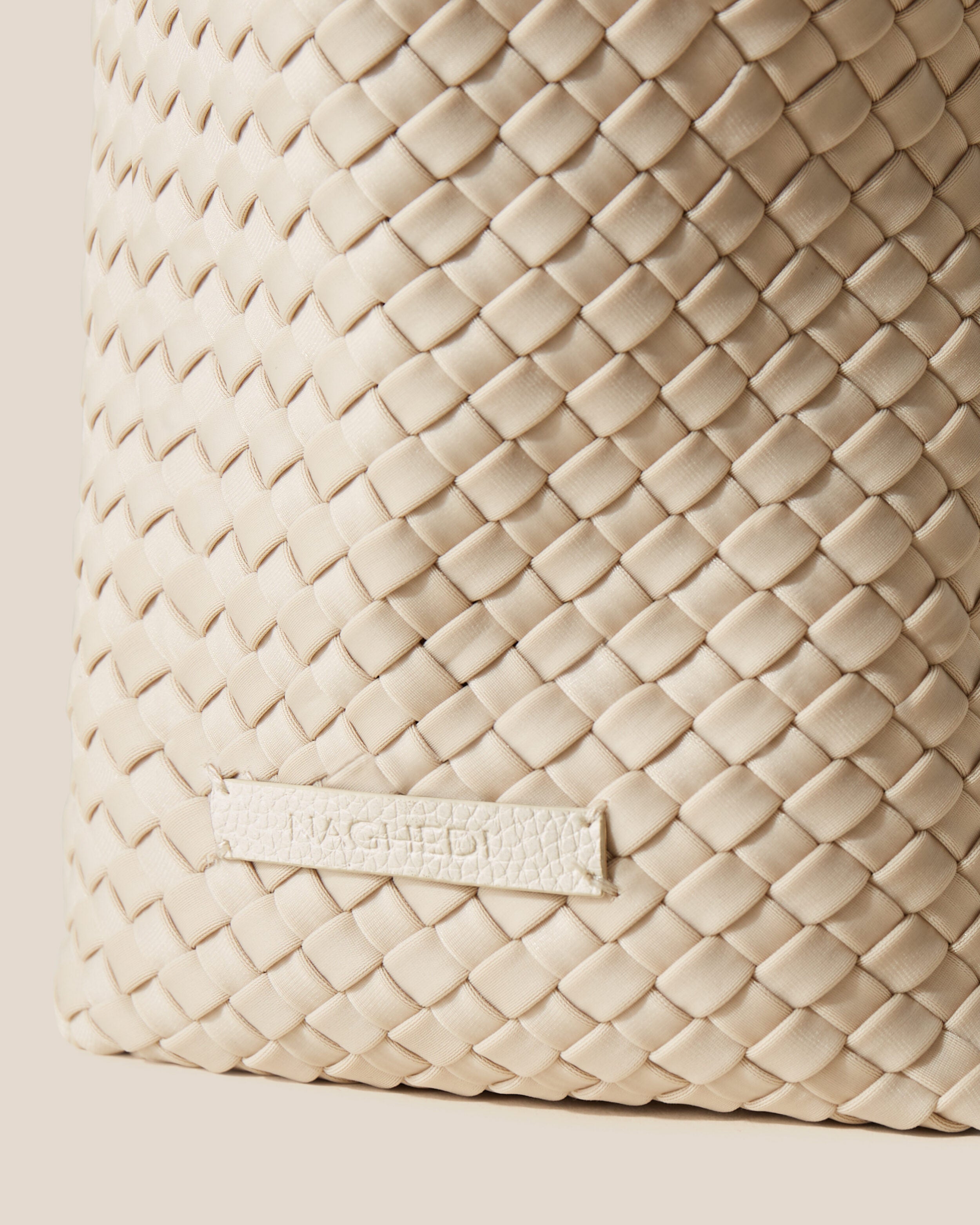 Close-up of stamped NAGHEDI logo on Jetsetter Tote in Ecru.