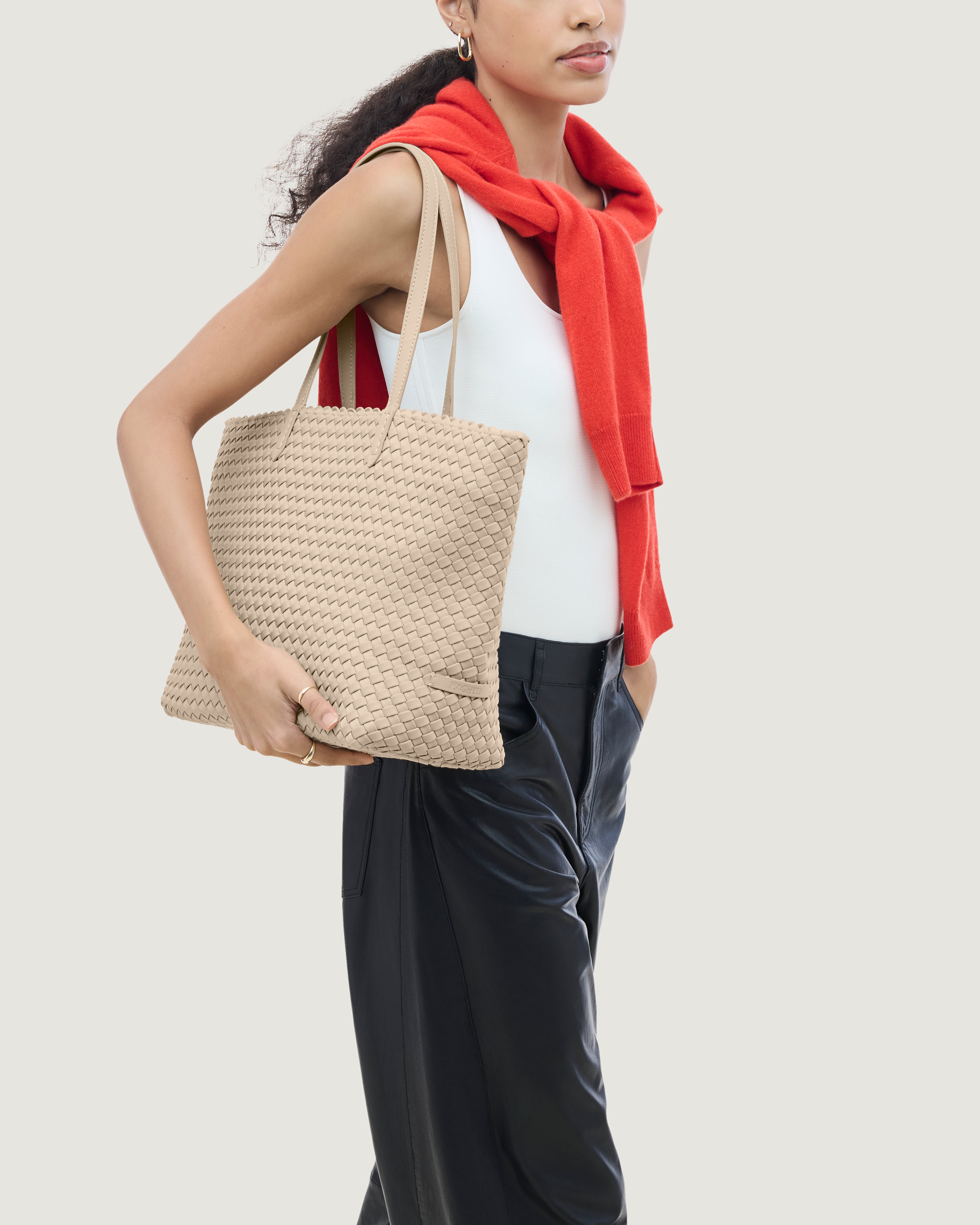 Jetsetter Tote in Ecru shown on model to illustrate scale and soft silhouette.