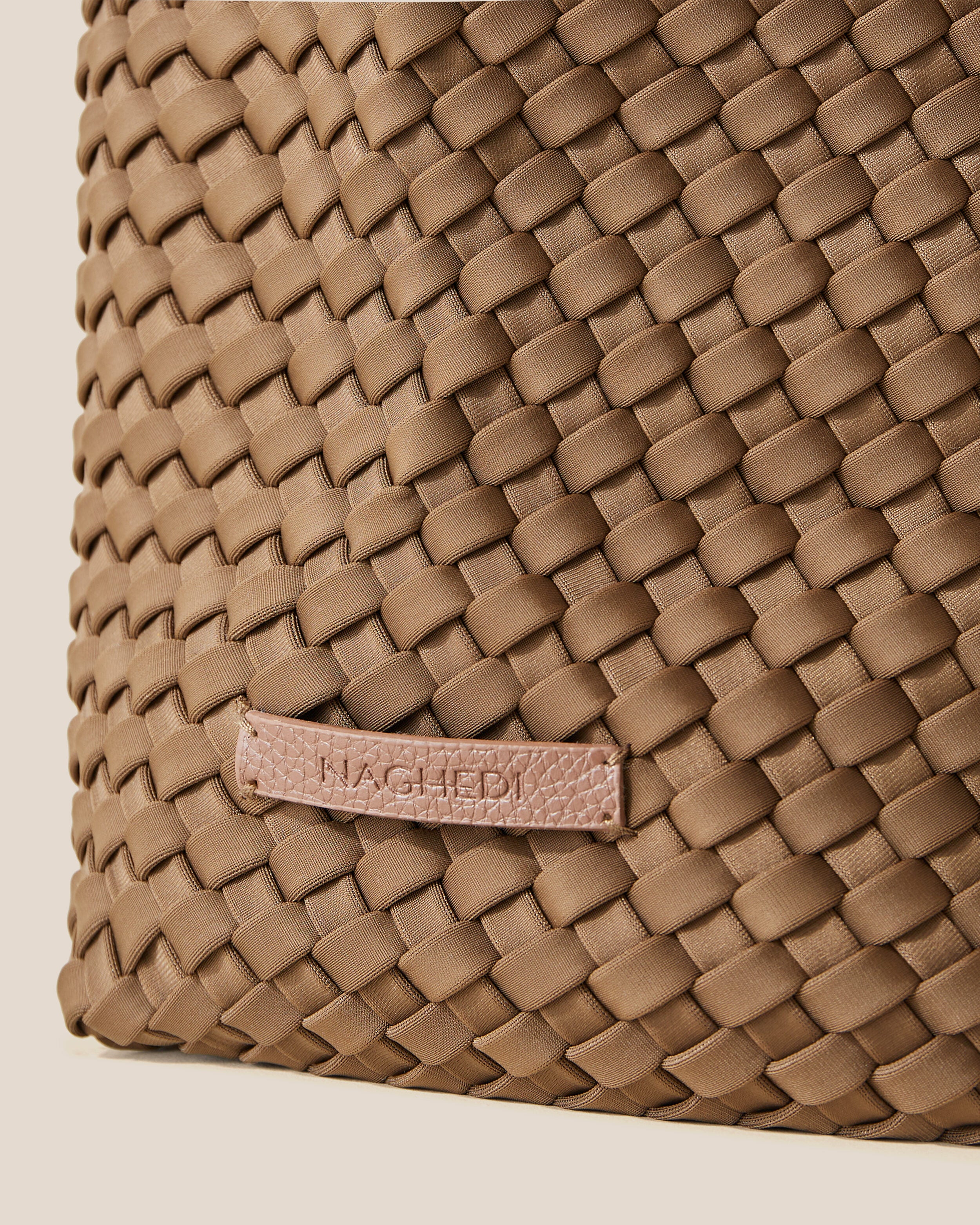 Close-up of stamped NAGHEDI logo on Jetsetter Tote in Mink.