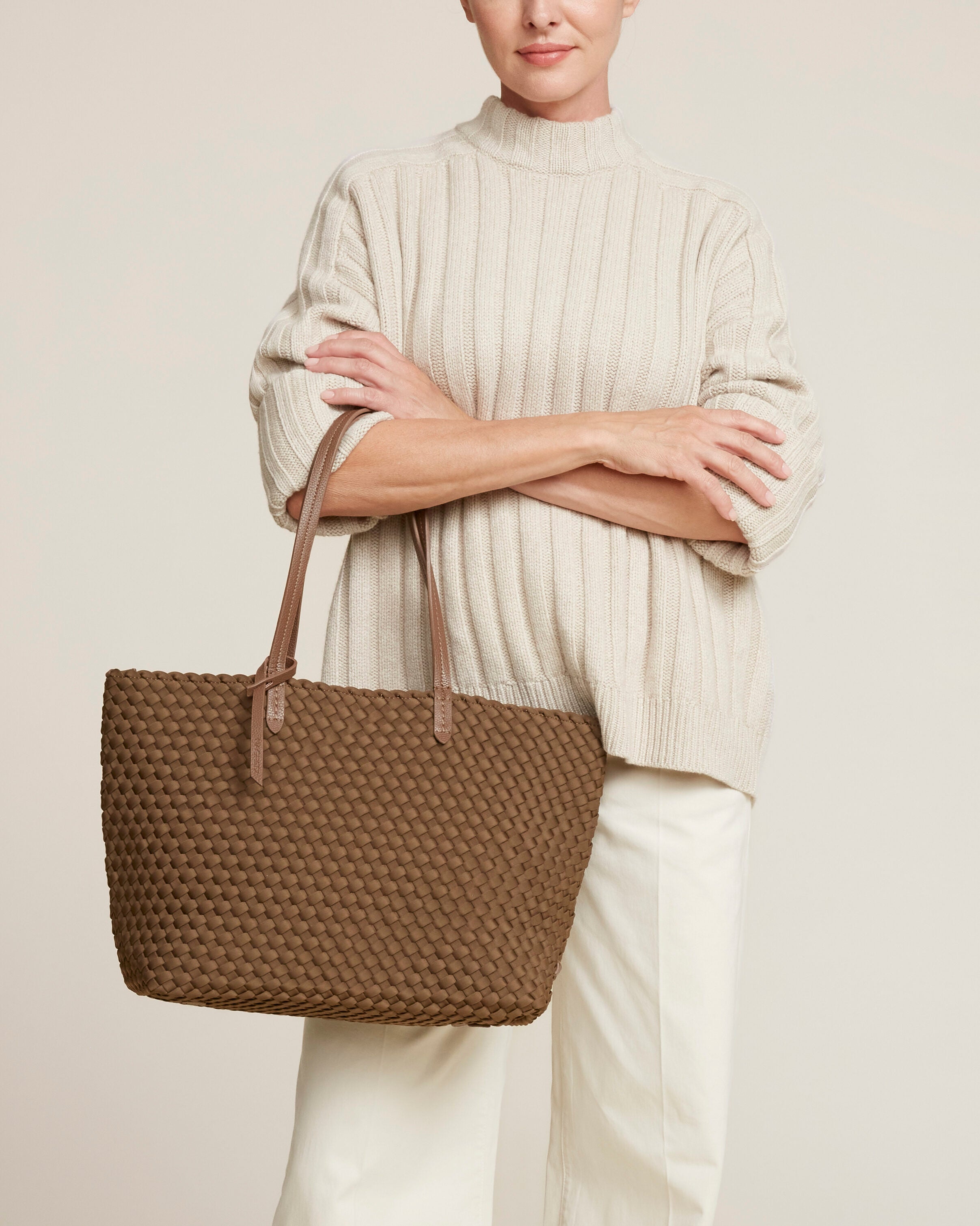 Jetsetter Tote in Mink shown on model to illustrate scale and soft silhouette.