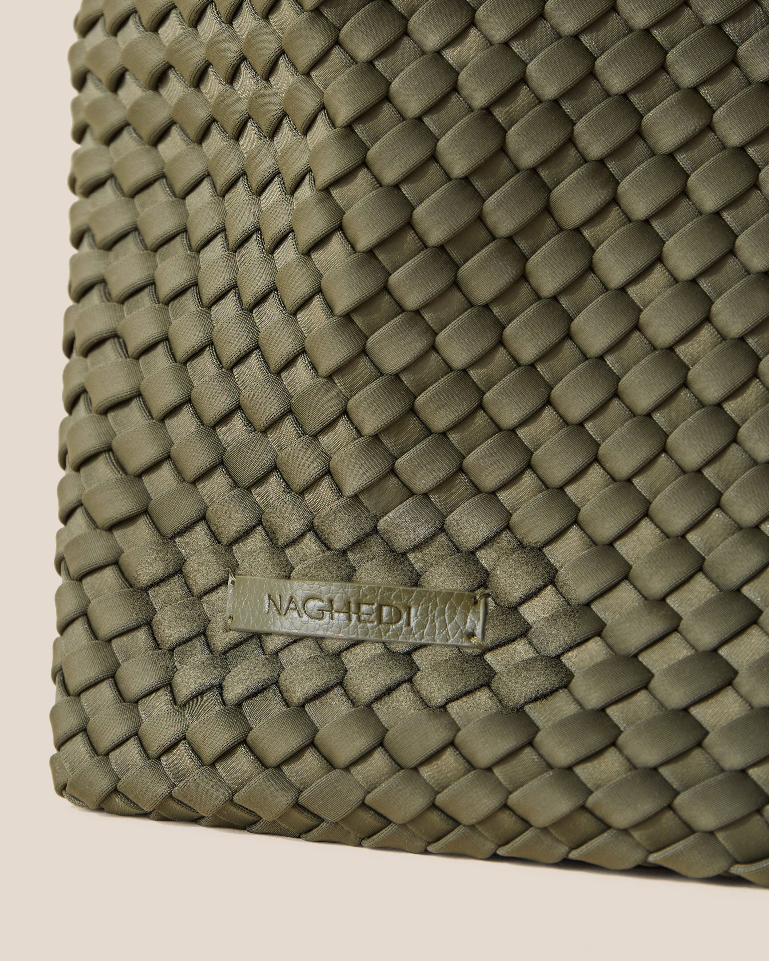 Close-up of stamped NAGHEDI logo on Jetsetter Tote in Olive.