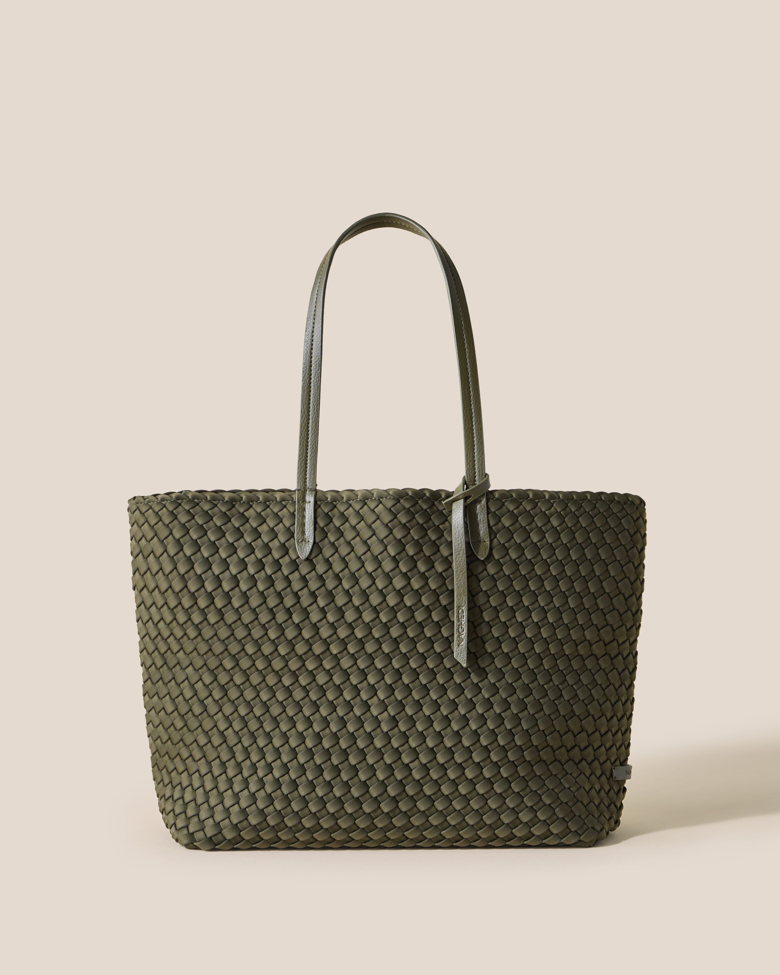 Jetsetter Tote in Olive, an olive green tone, in handwoven neoprene, featuring a top zip closure, and vegan leather handles.