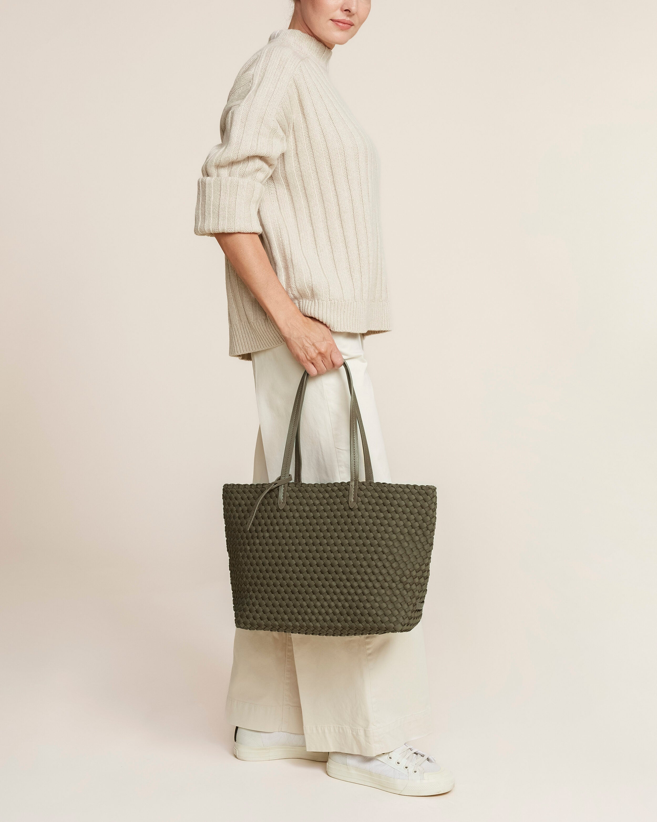 Jetsetter Tote in Olive shown on model to illustrate scale and soft silhouette.
