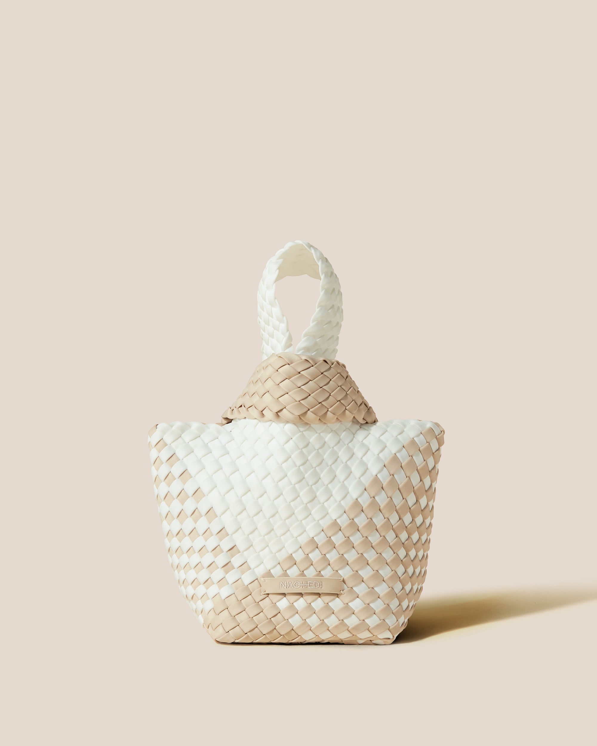 Kyoto Clutch in Athena, a white and cream tone, in handwoven neoprene, featuring a secure slide-through loop closure.