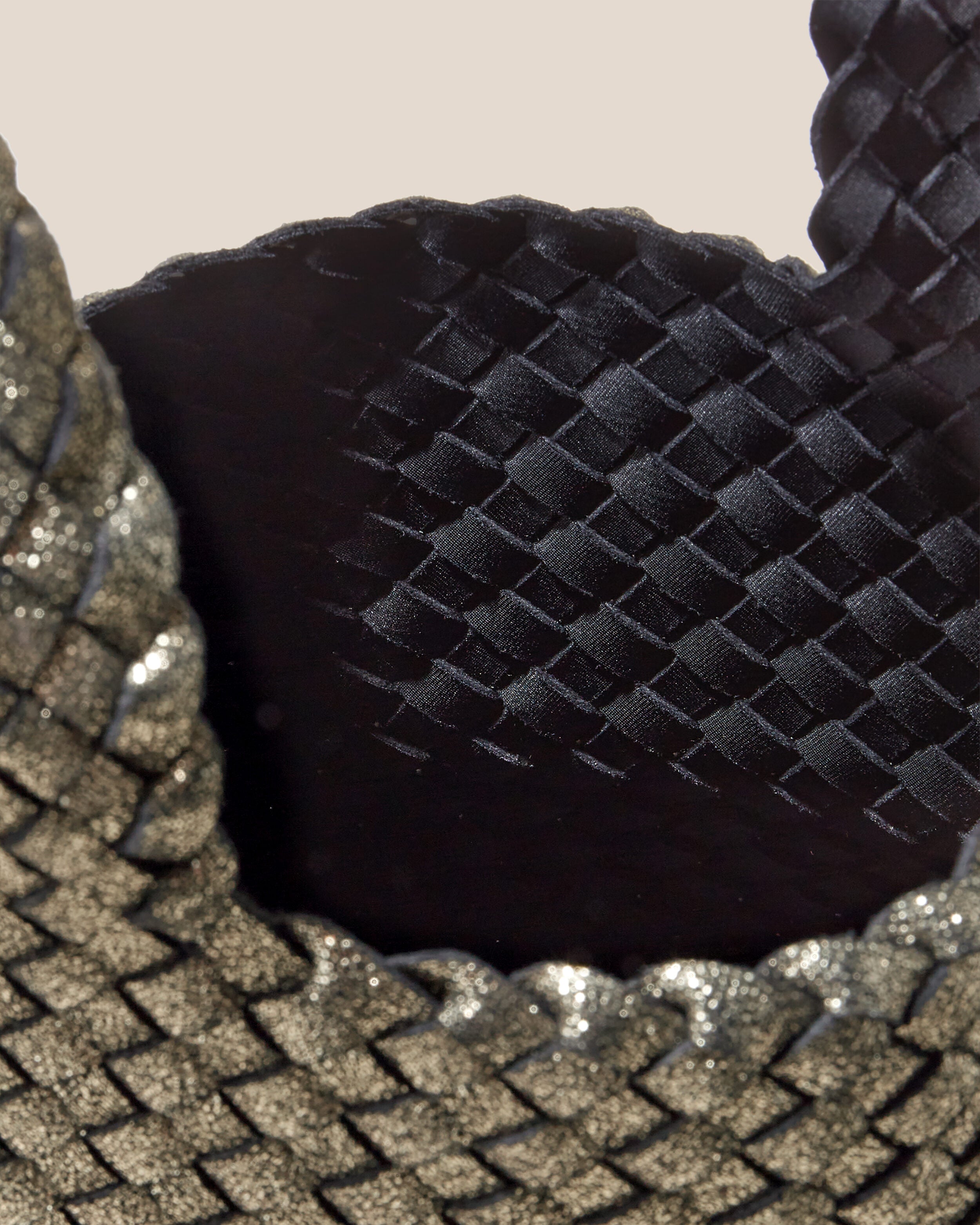 Interior close-up of Kyoto Clutch in Etoile showing its secure slide-through loop closure, and unlined interior.