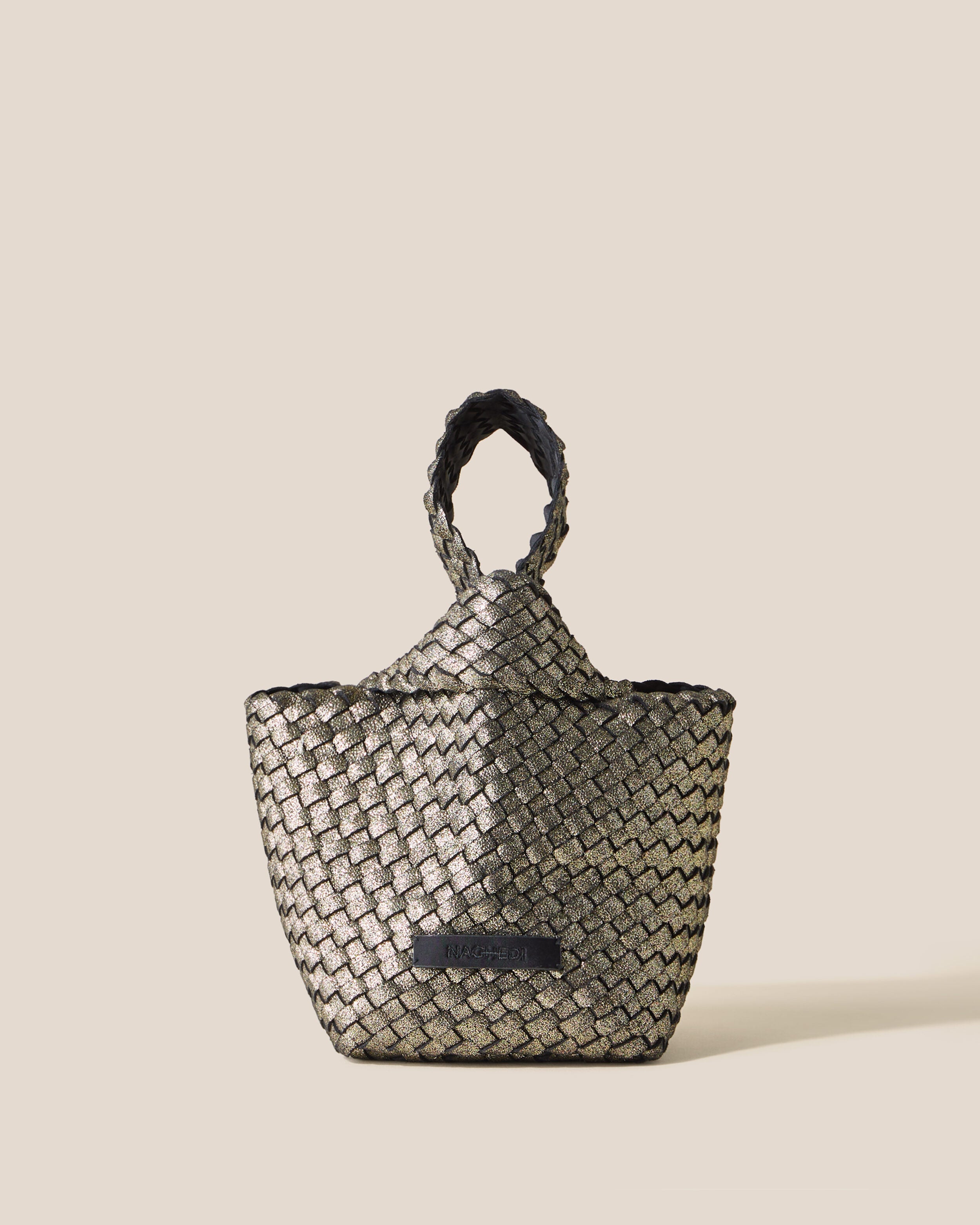 Kyoto Clutch in Etoile, a metallic gold tone, in handwoven neoprene, featuring a secure slide-through loop closure.