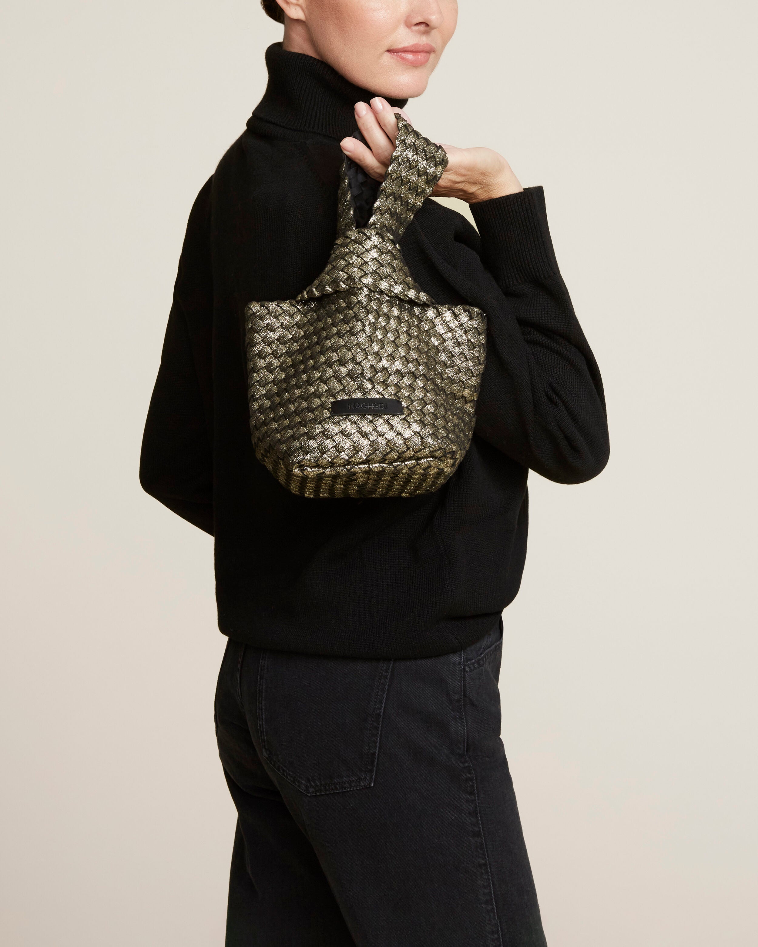 Kyoto Clutch in Etoile shown on model to illustrate scale and soft silhouette.