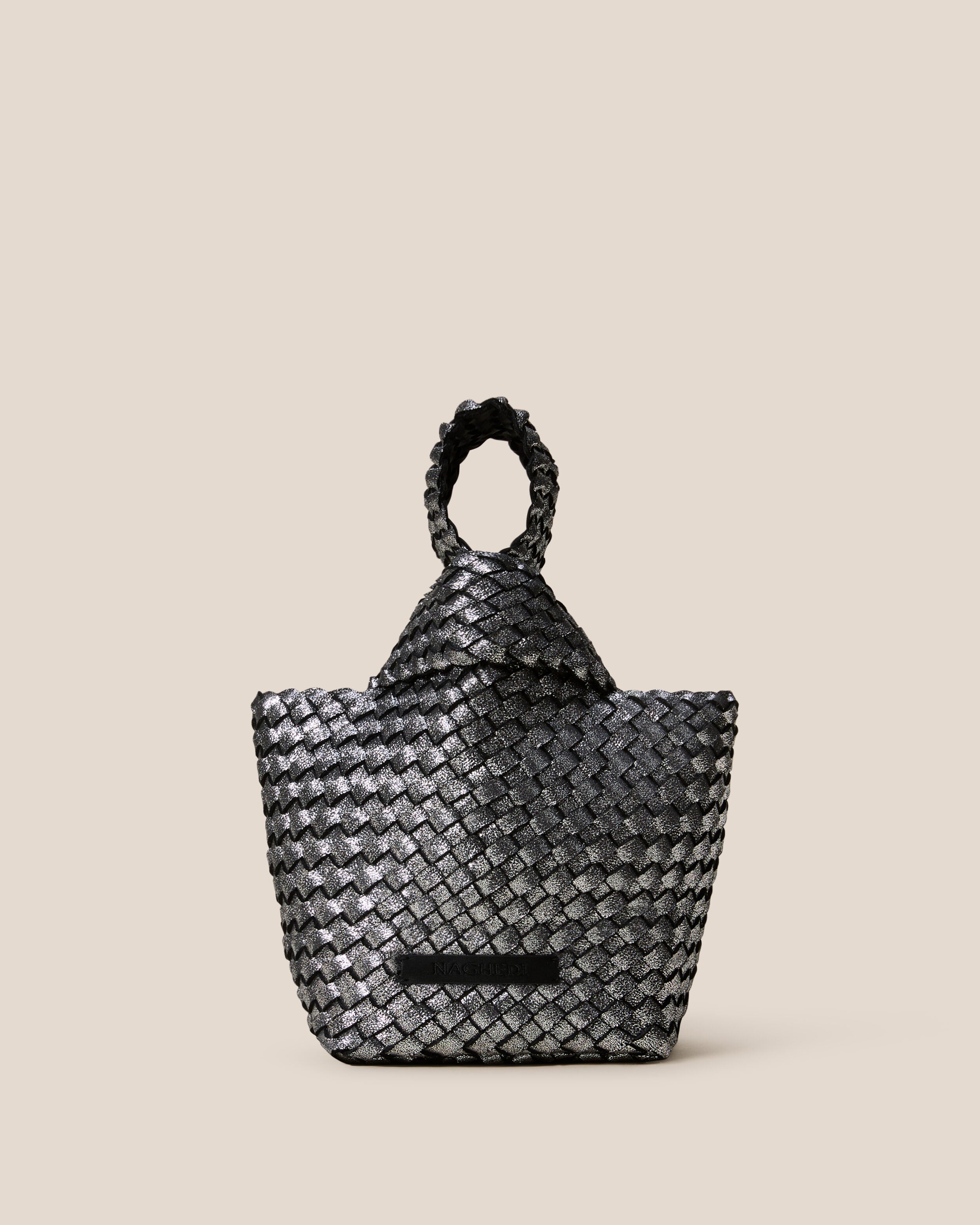 Kyoto Clutch in Titanium, a silver tone, in handwoven neoprene, featuring a secure slide-through loop closure.