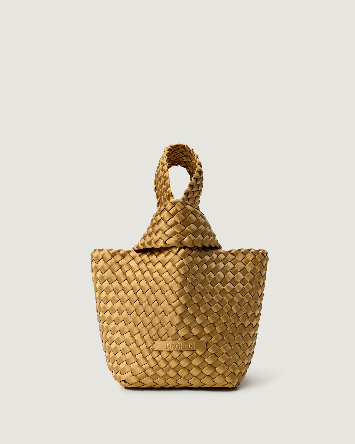 Kyoto Clutch in Luce, a gold tone, in handwoven satin, featuring a secure slide-through loop closure.