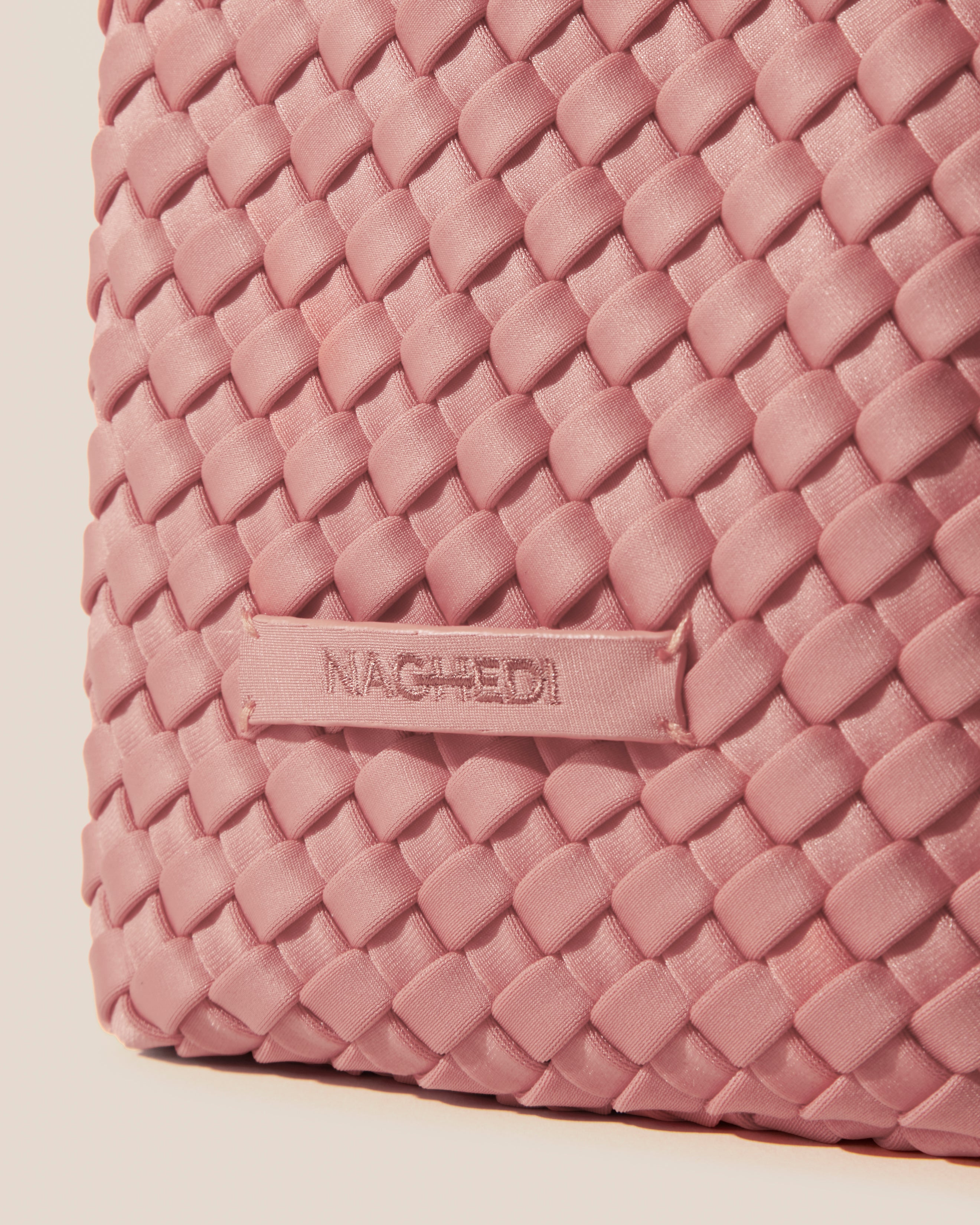 Close-up of stamped NAGHEDI logo on Kyoto Clutch in Dusk.