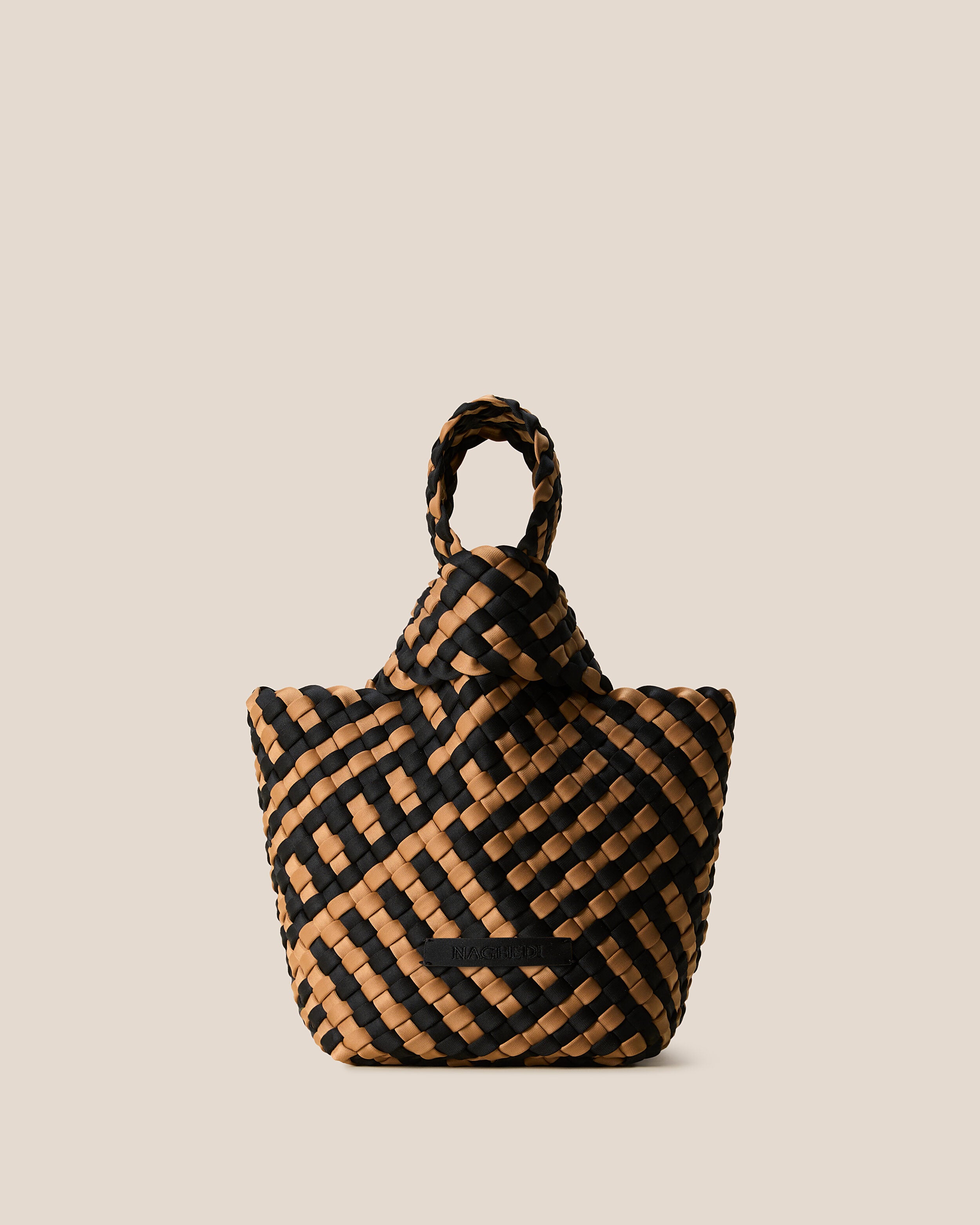 Kyoto Clutch in Ravenna, a tan brown and true black tone, in handwoven neoprene, featuring a secure slide-through loop closure.
