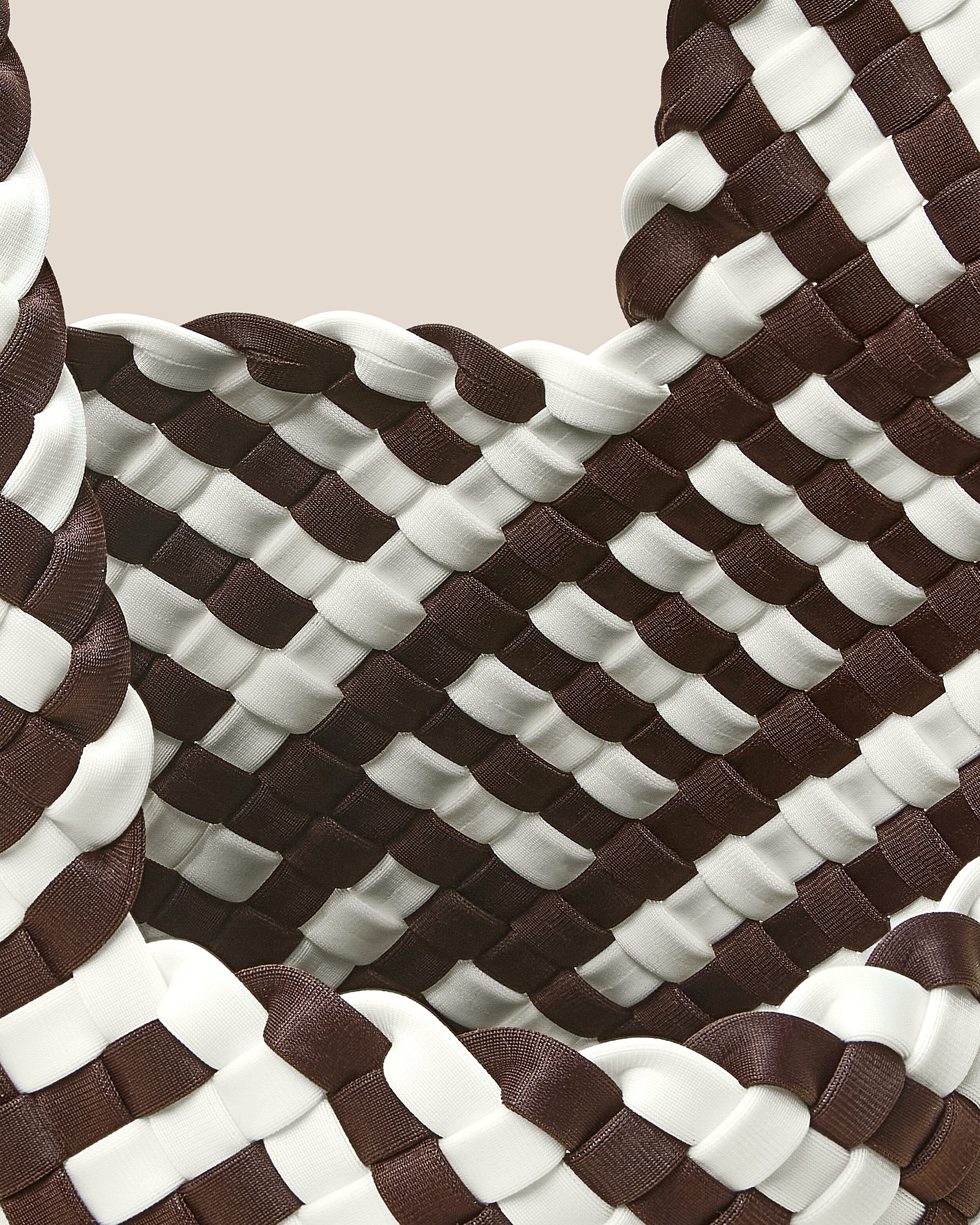 Interior close-up of Kyoto Clutch in Roma showing its secure slide-through loop closure, and unlined interior.