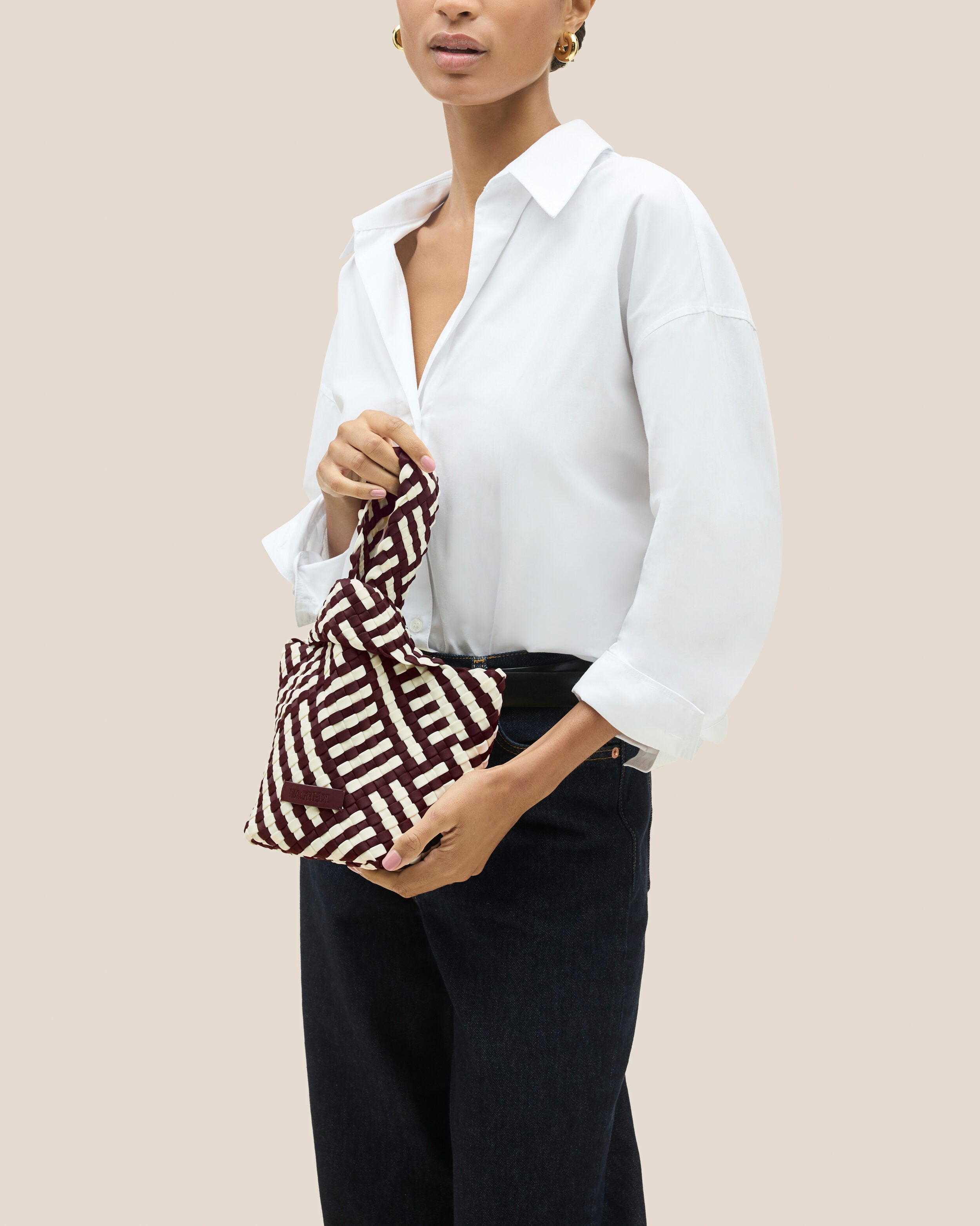 Kyoto Clutch in Roma shown on model to illustrate scale and soft silhouette.