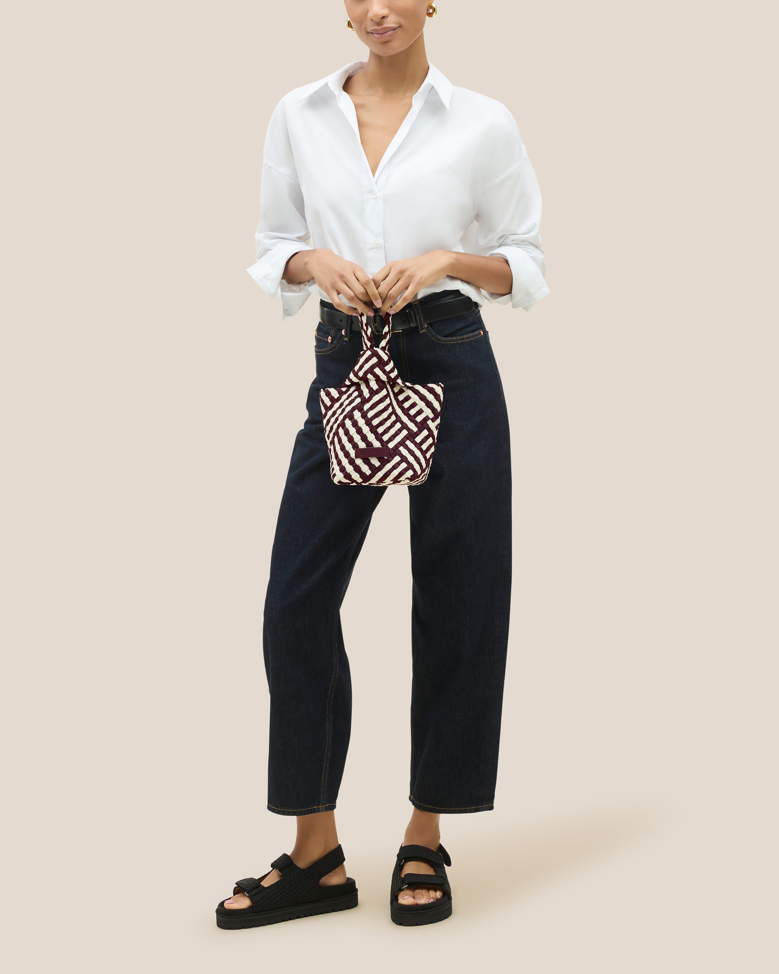 Kyoto Clutch in Roma shown on model to illustrate scale and soft silhouette.