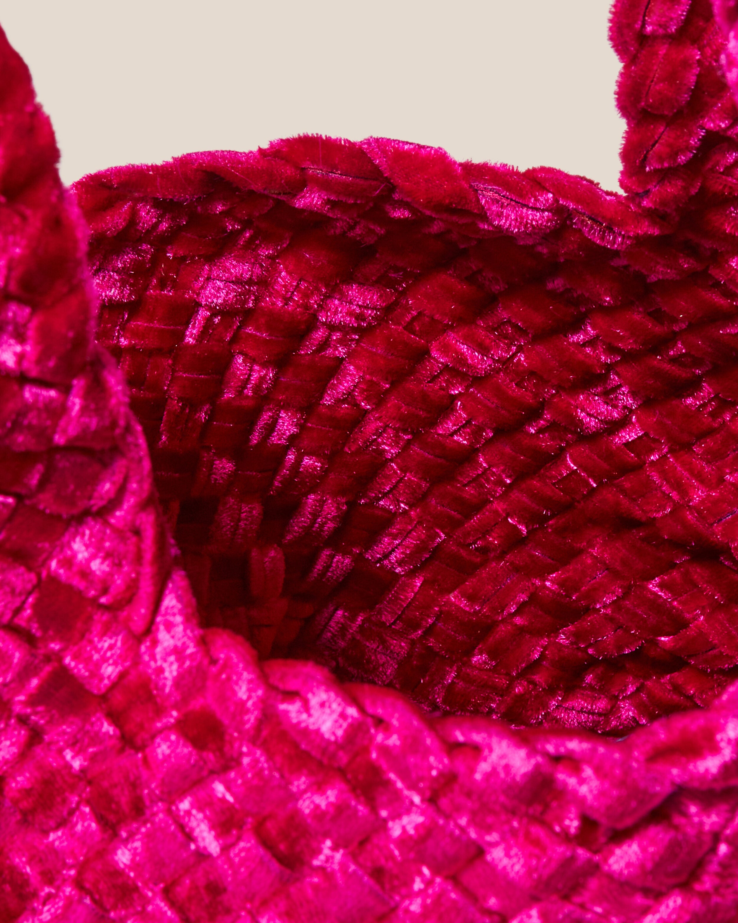 Interior close-up of Kyoto Clutch in Crush showing its secure slide-through loop closure, and unlined interior.