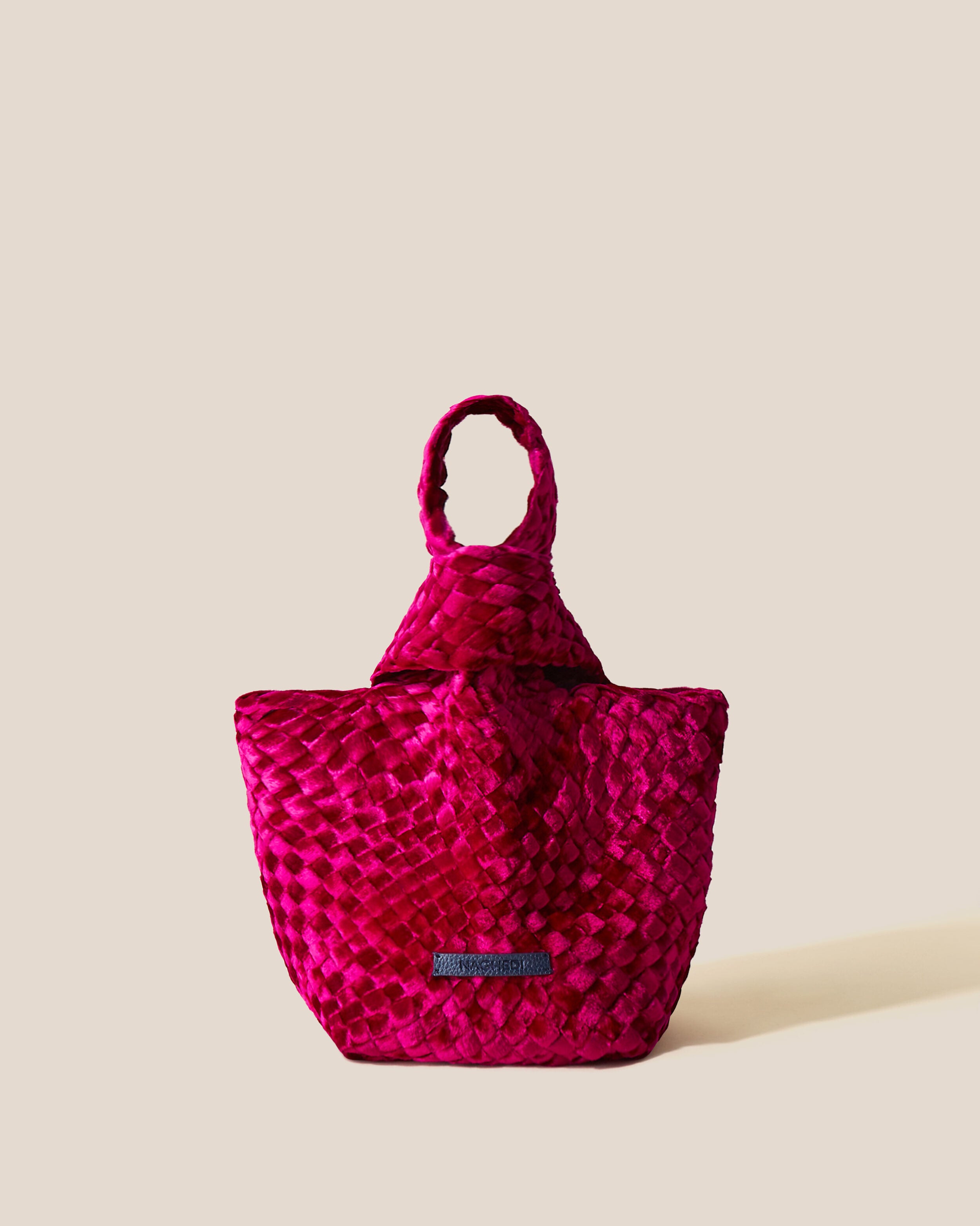 Kyoto Clutch in Crush in handwoven neoprene, featuring a secure slide-through loop closure.