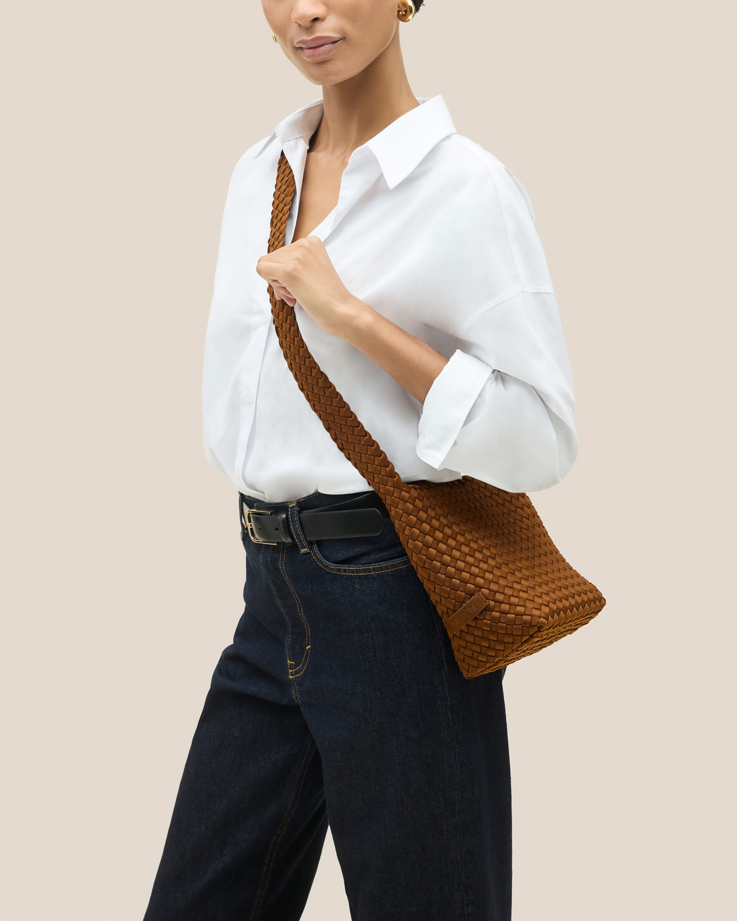 Laguna Crossbody in Teak shown on model to illustrate scale and soft silhouette.