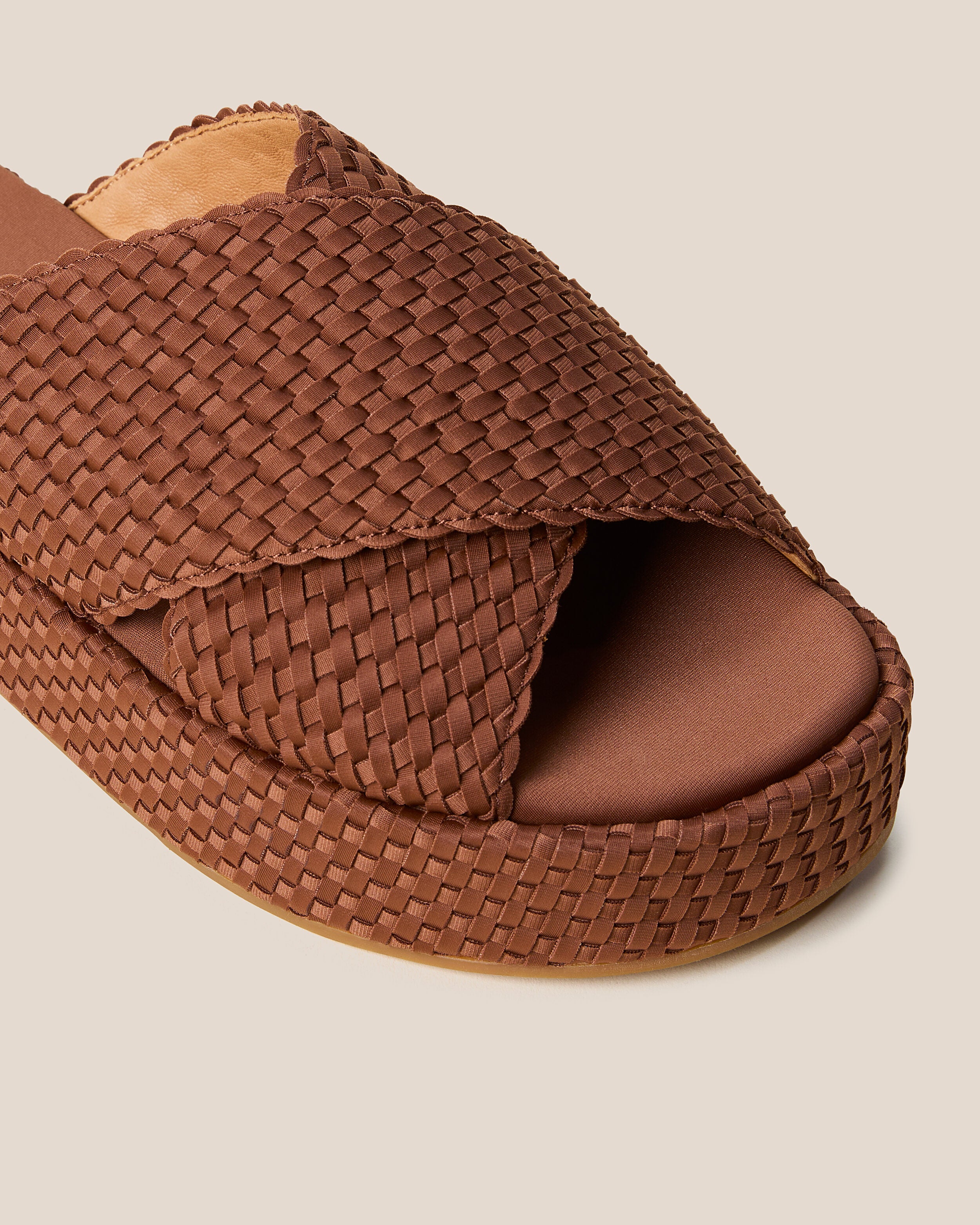 Close-up of The Laguna Platform in Adobe showing its open toe and round silhouette.