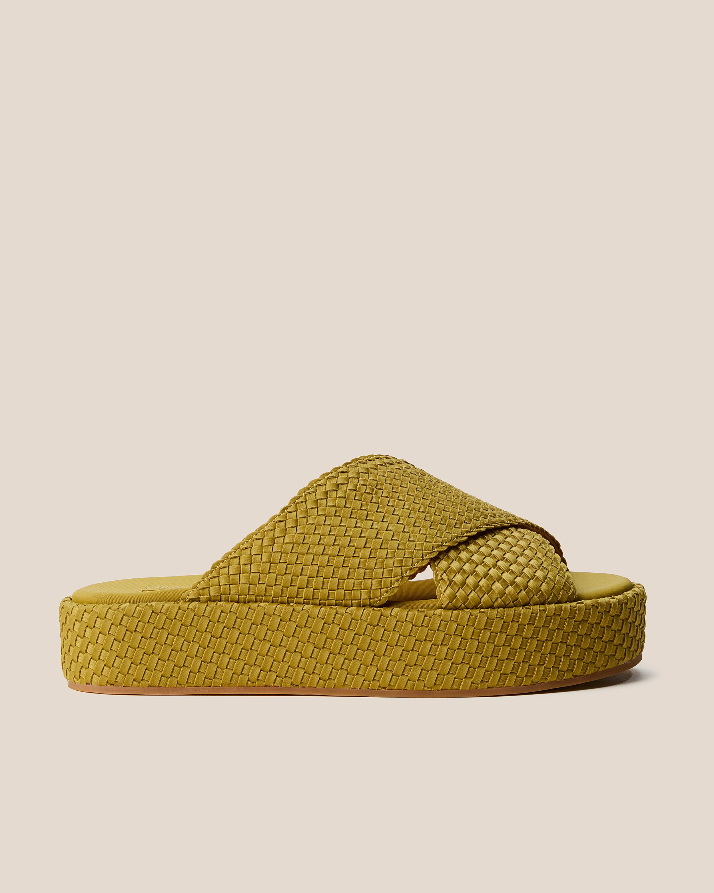 Side view of The Laguna Platform in Chartreuse, a yellow-green tone, featuring an open toe and round silhouette.