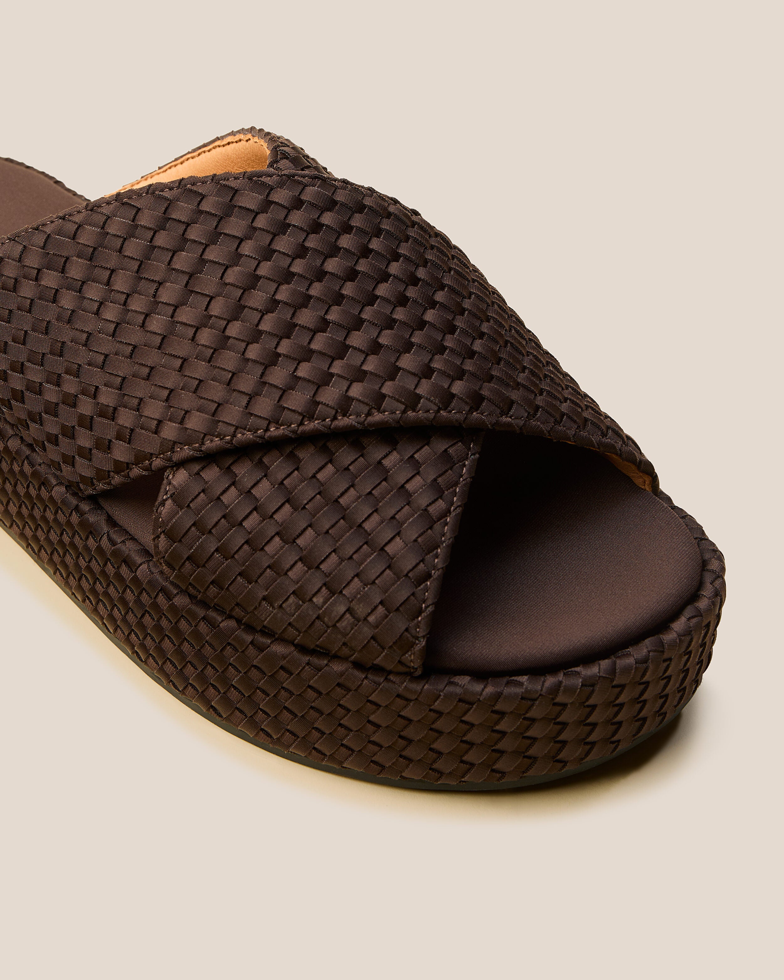 Close-up of The Laguna Platform in Chocolate showing its open toe and round silhouette.