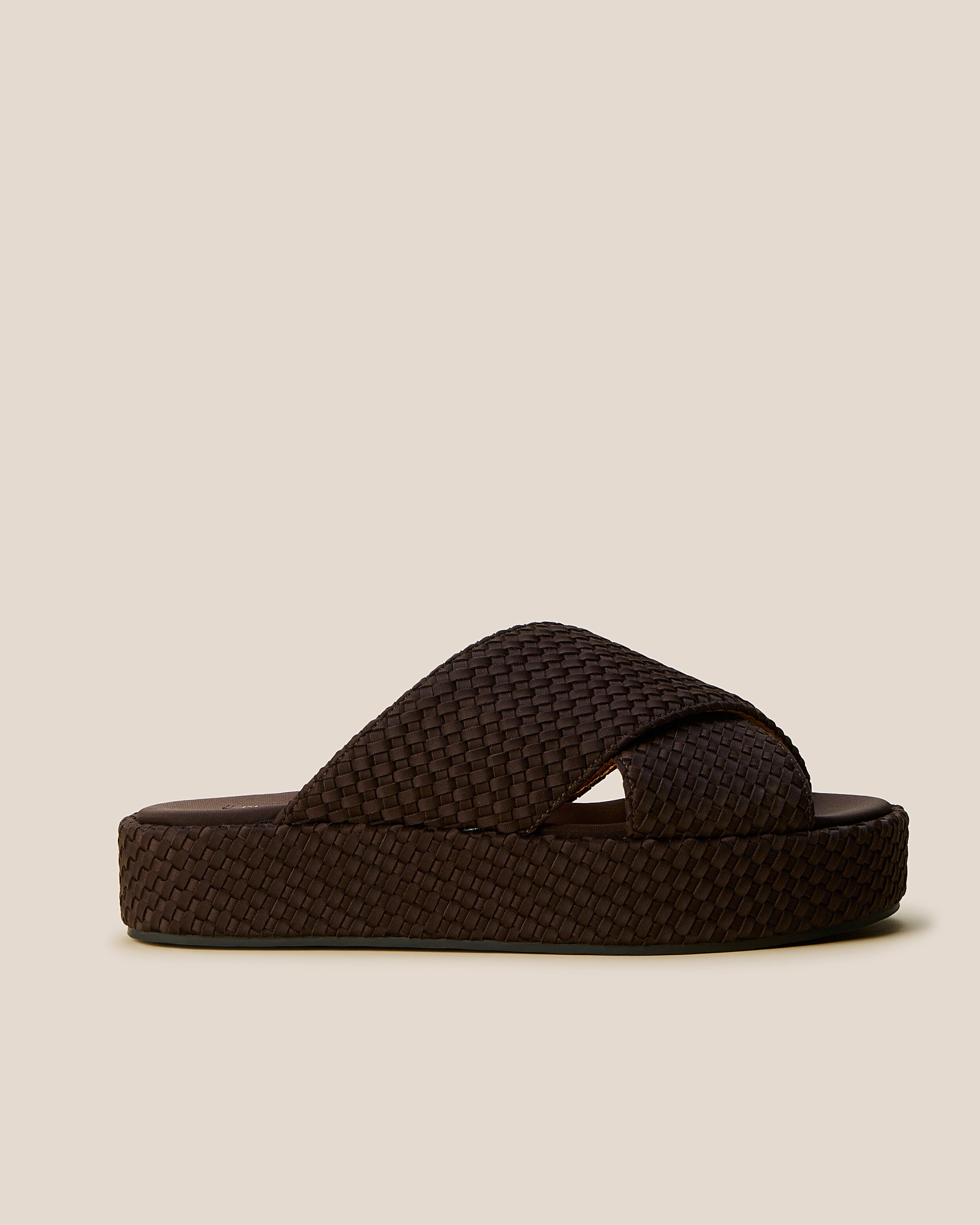 Side view of The Laguna Platform in Chocolate, a dark chocolate brown tone, featuring an open toe and round silhouette.