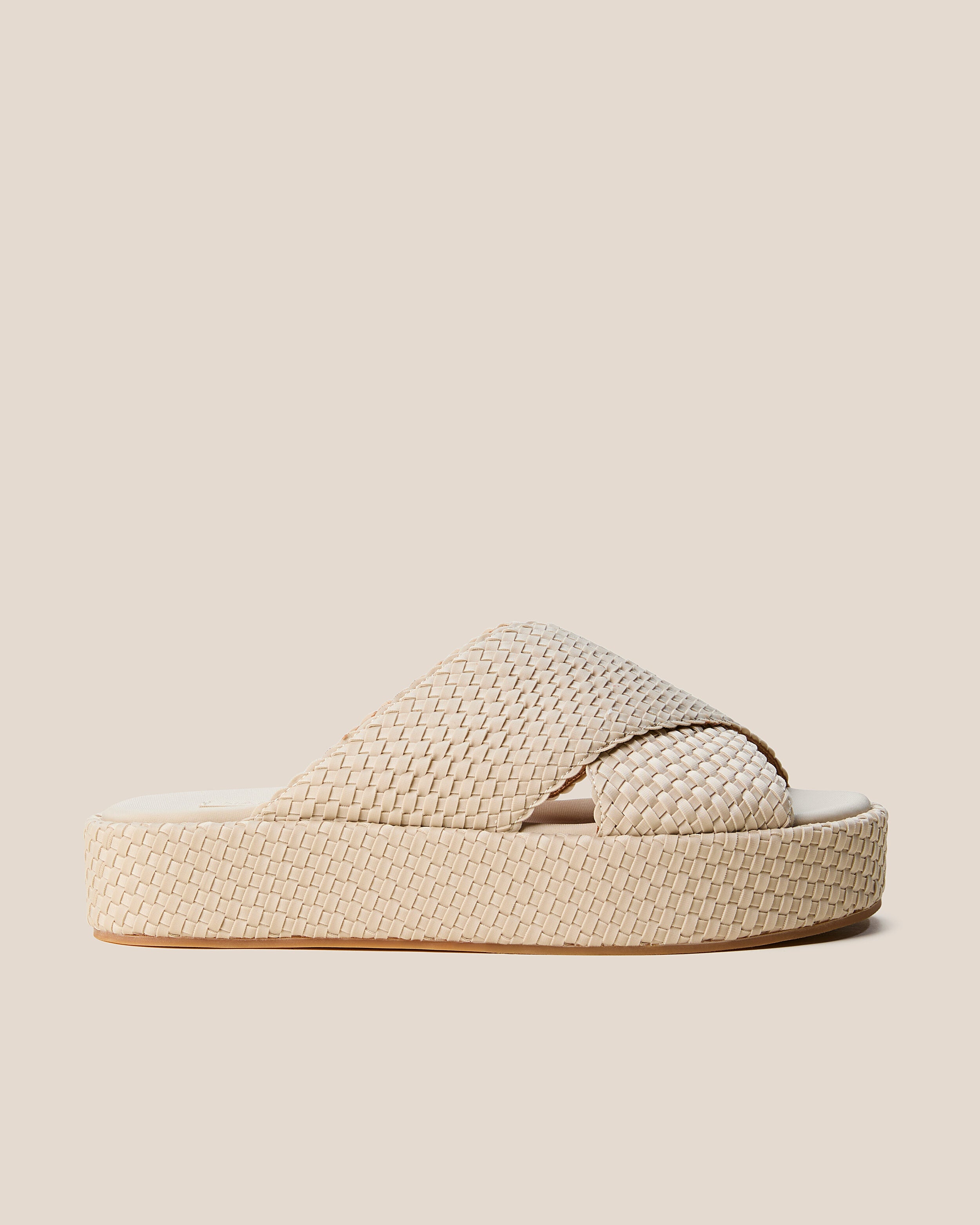 Side view of The Laguna Platform in Ecru, a cream tone, featuring an open toe and round silhouette.