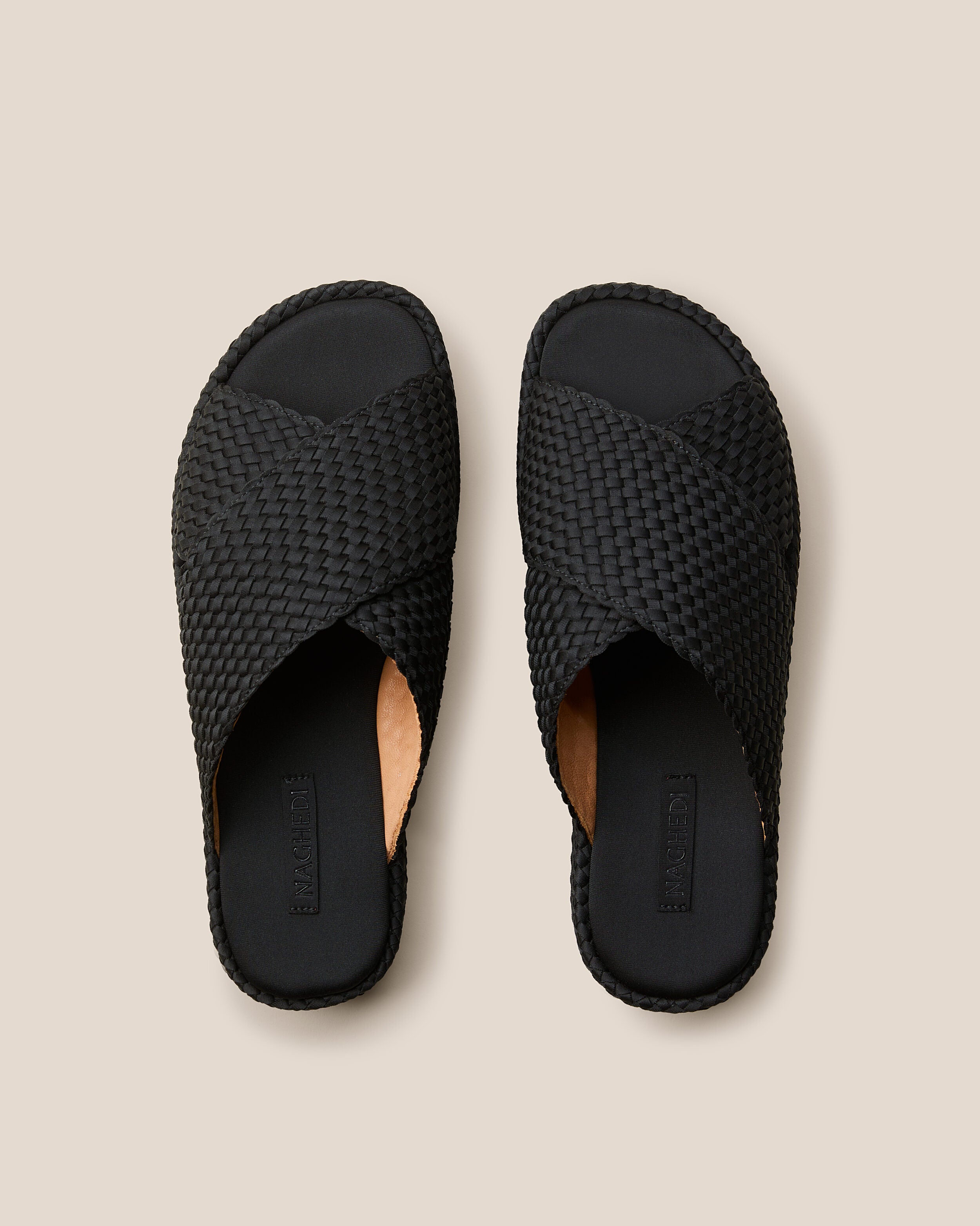 Top view of pair of The Laguna Platform in Onyx showing the padded neoprene insole.