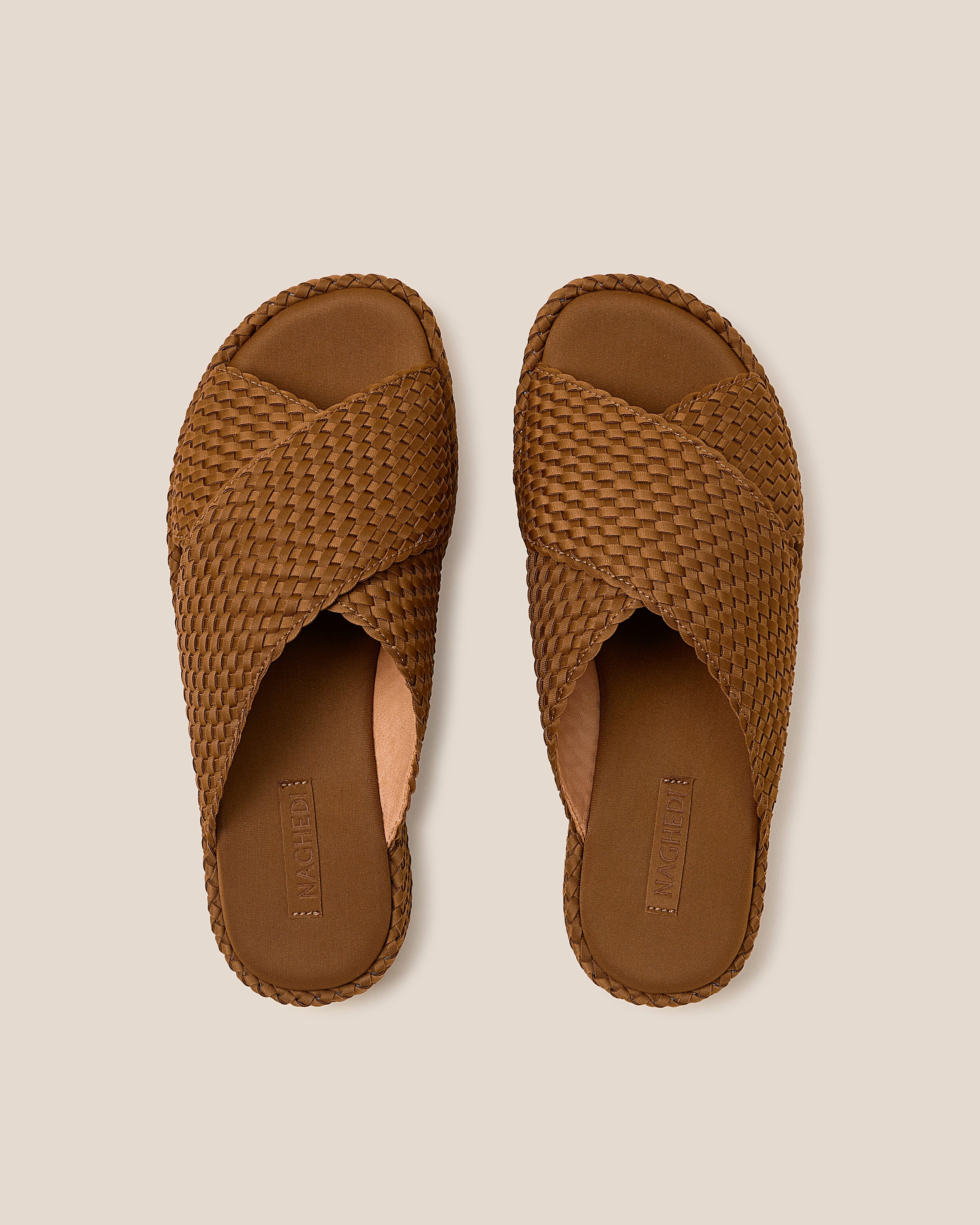 Top view of pair of The Laguna Platform in Teak showing the padded neoprene insole.