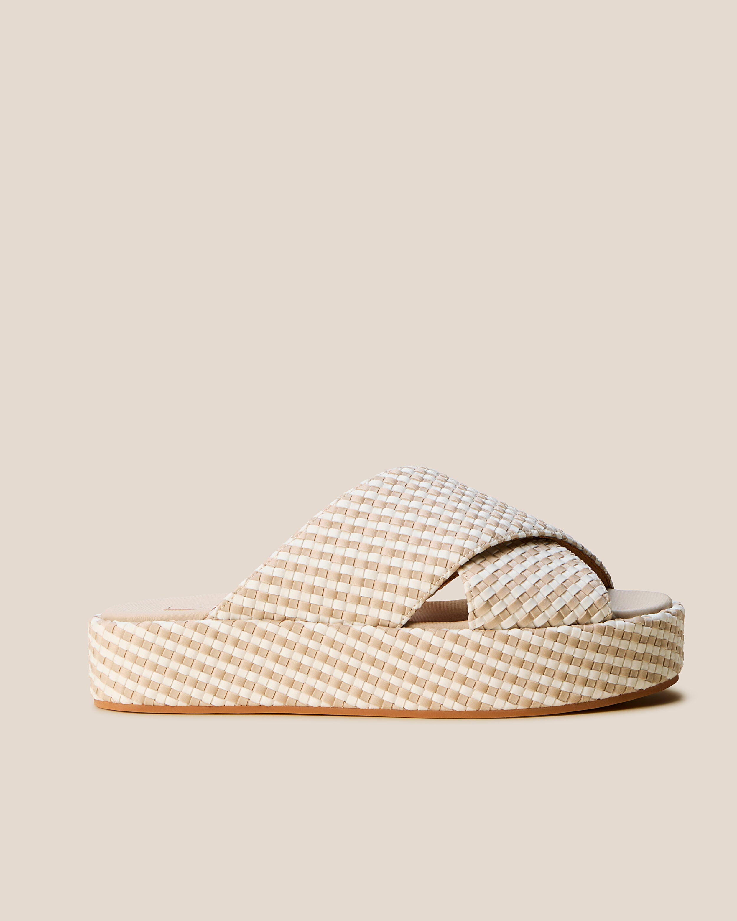 Side view of The Laguna Platform in Mykonos, a cream and ivory tone, featuring an open toe and round silhouette.