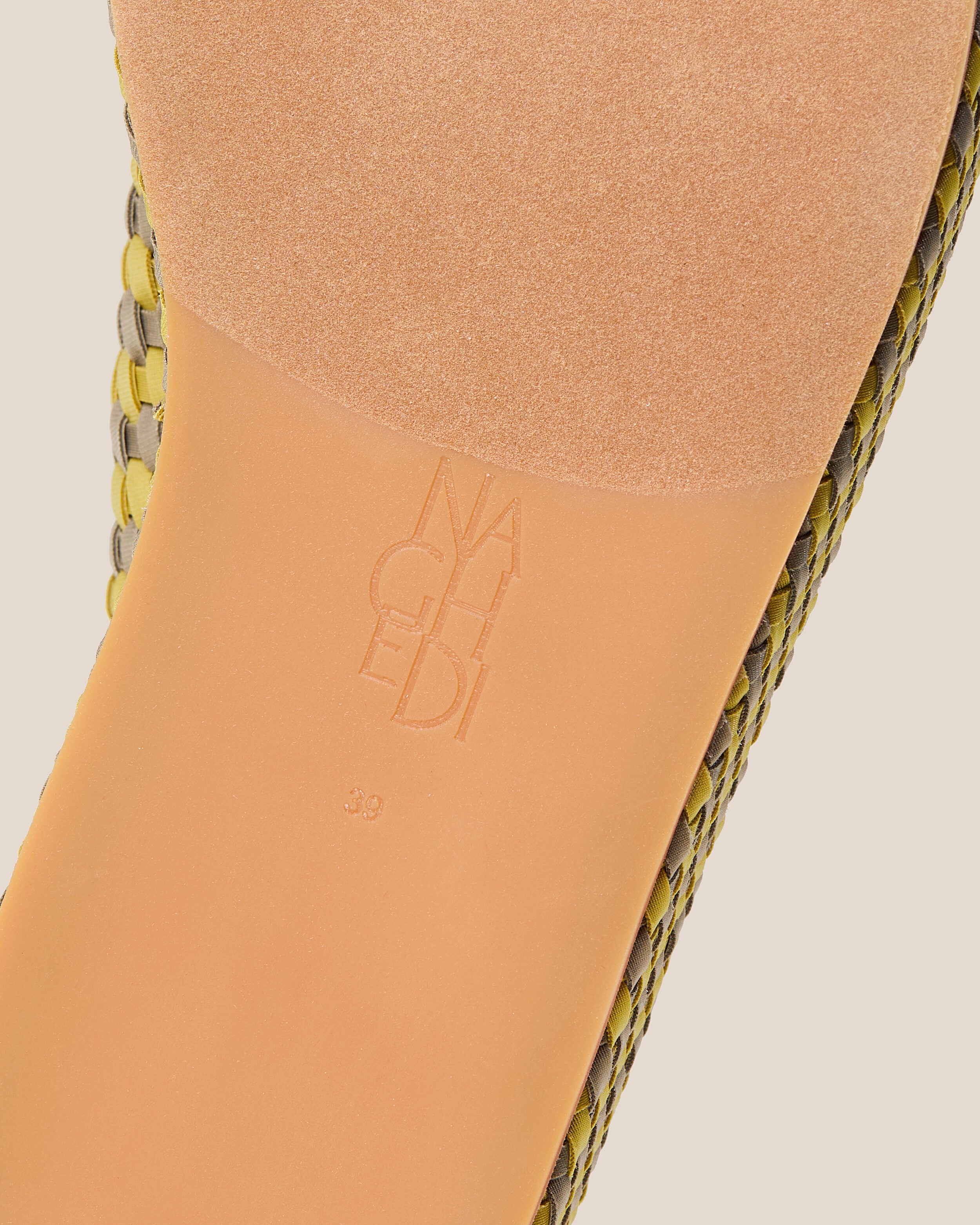 Shoe sole showing natural rubber sole, stamped NAGHEDI logo and size detail for The Laguna Platform in Palma.