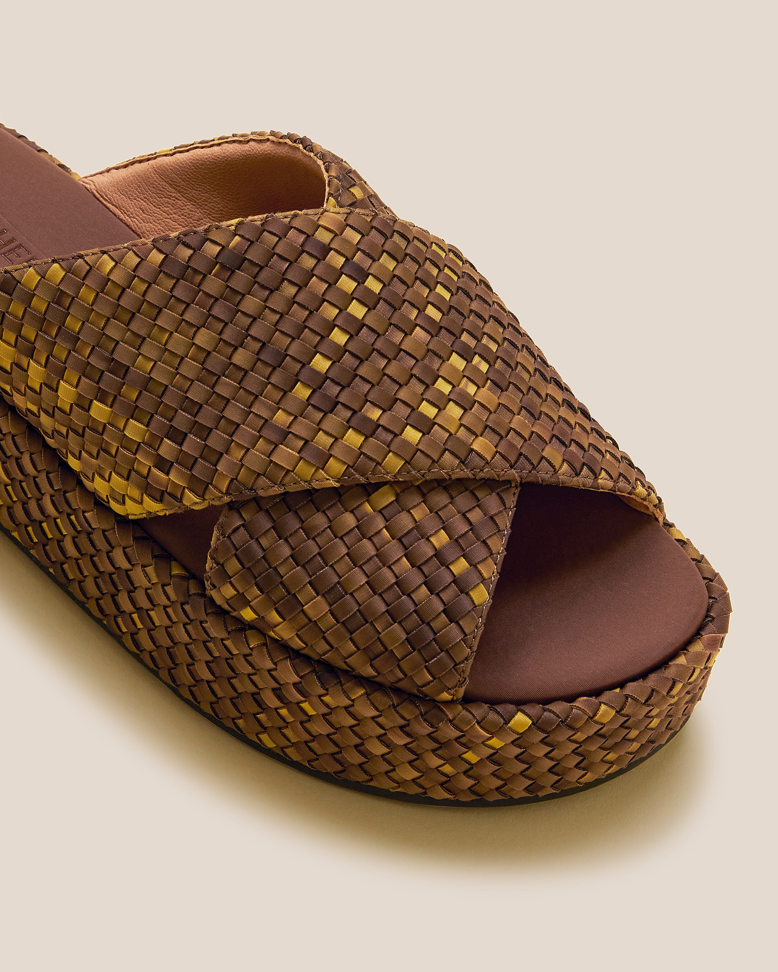 Close-up of The Laguna Platform in Tortoiseshell showing its open toe and round silhouette.