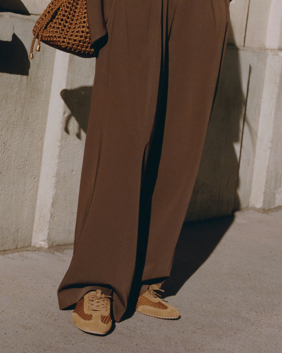 On Model view of the Milan Sneaker in Teak. Highlighting the handwoven neoprene and suede tonal combination.