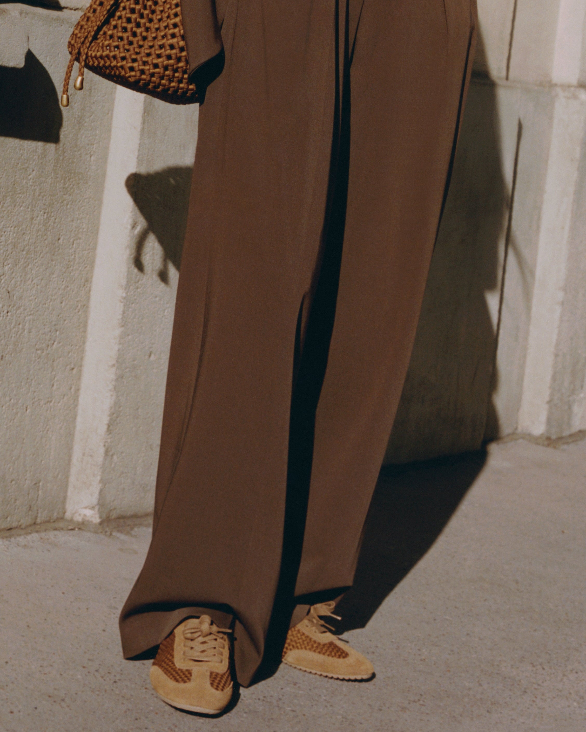 On Model view of the Milan Sneaker in Teak. Highlighting the handwoven neoprene and suede tonal combination.