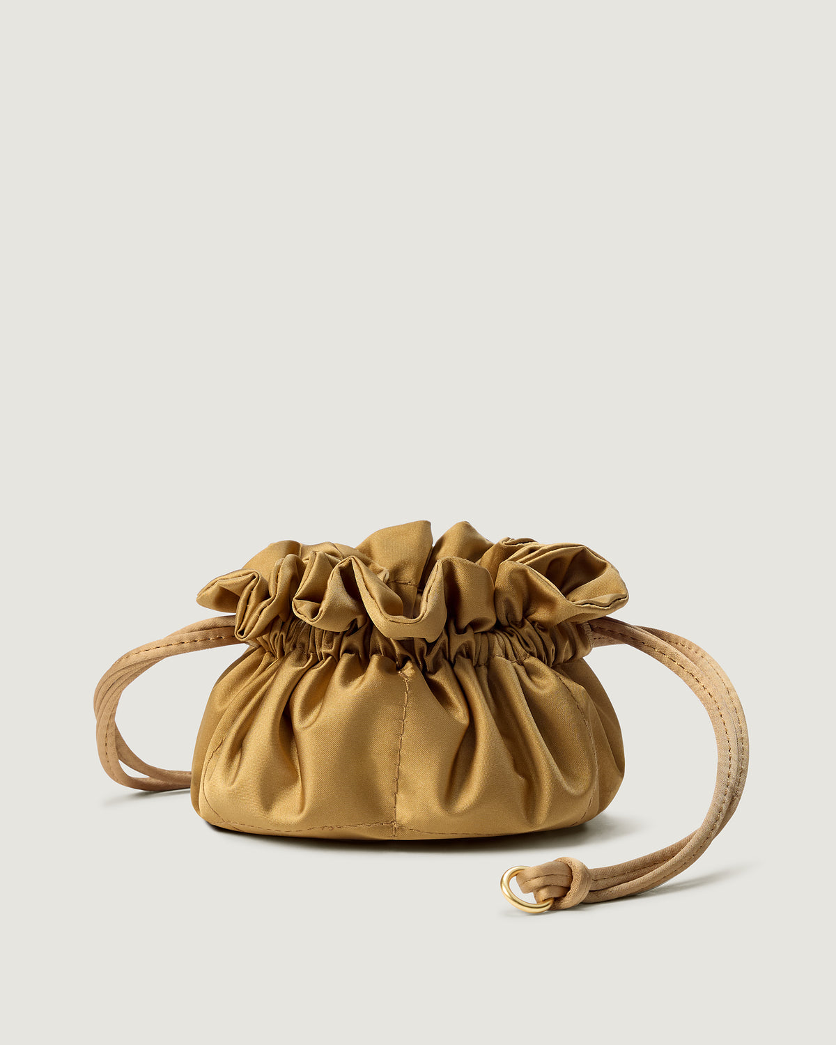 A small gold satin drawstring jewelry pouch.