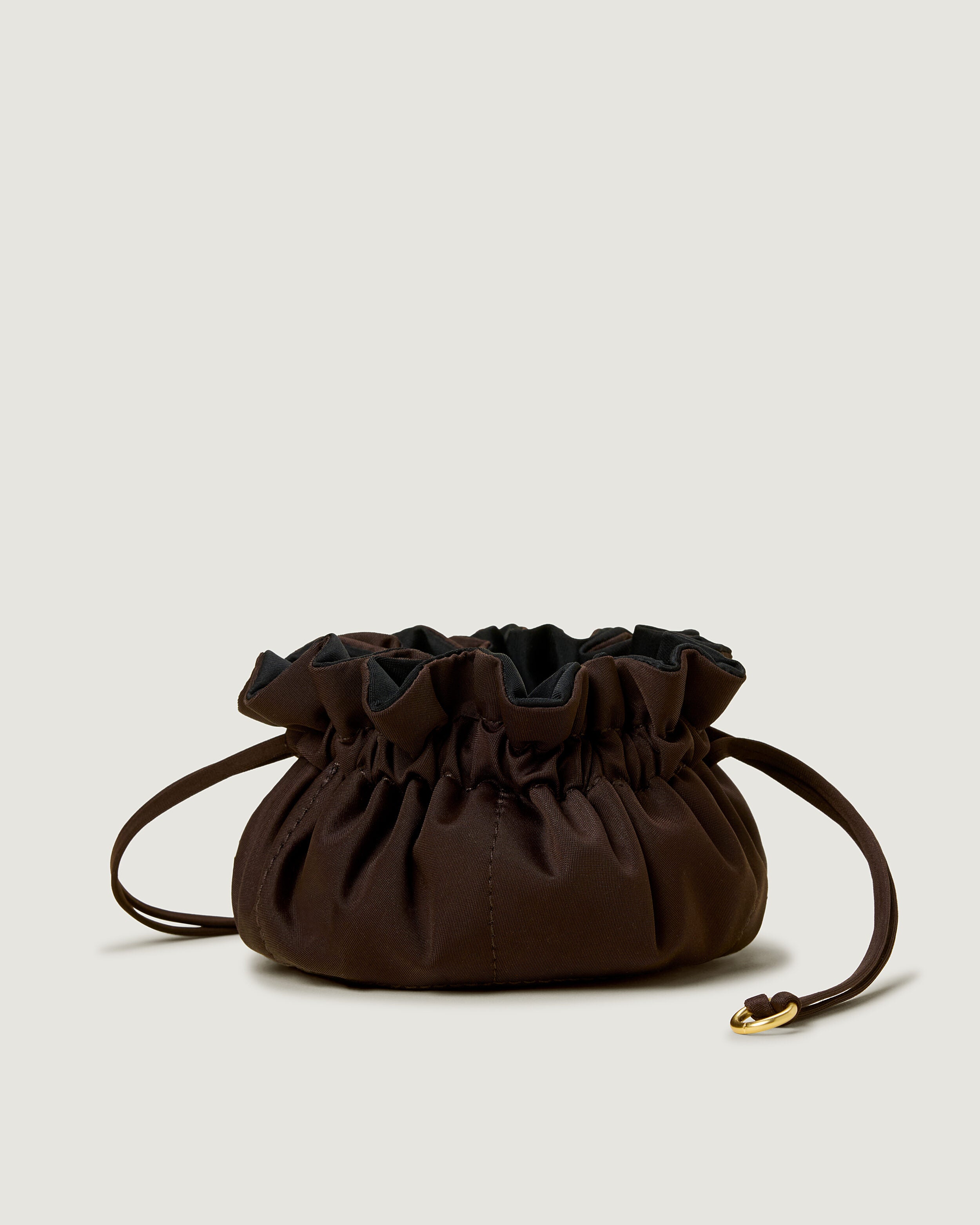 Lotus Jewelry Pouch in Chocolate featuring a drawstring closure.